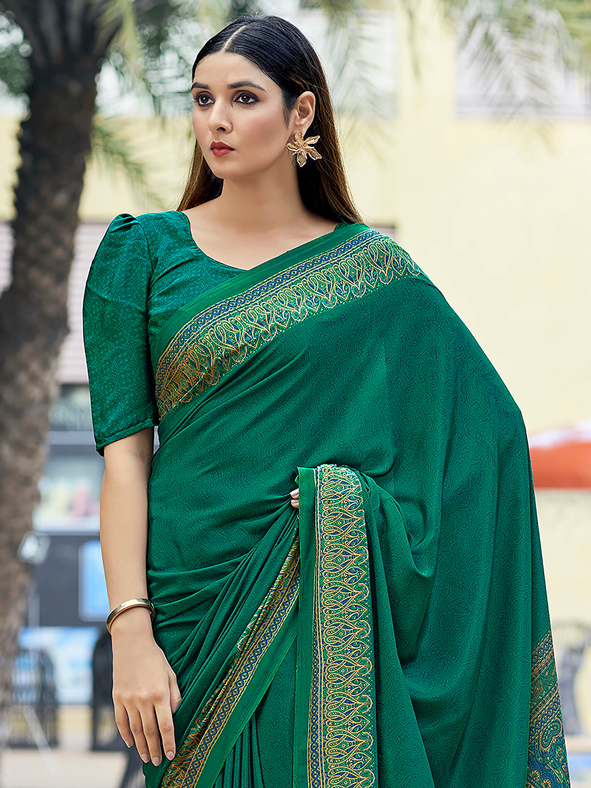 Green printed crepe silk casual saree with contrast border and pallu