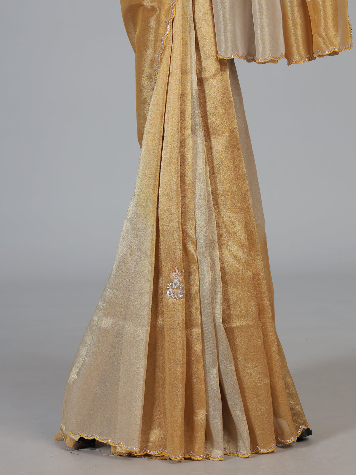 Golden and beige tissue silk festive saree with luxurious embellishments