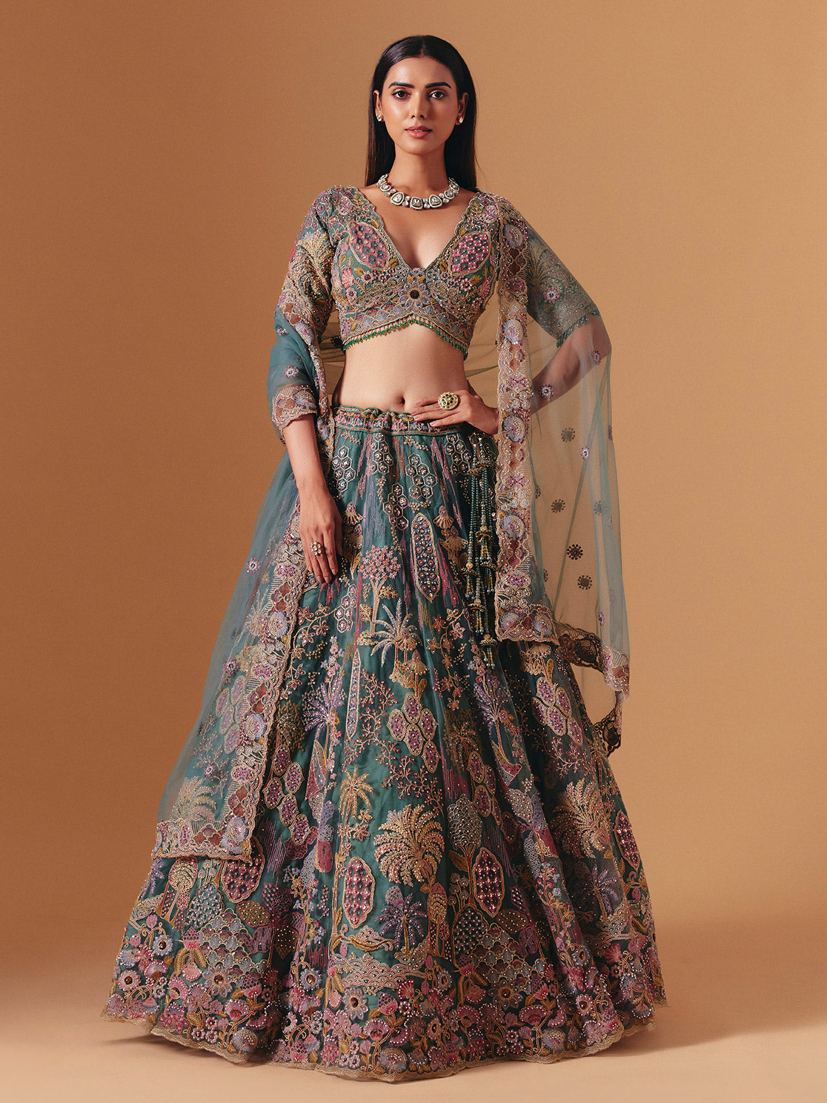Teal green net designer lehenga choli with elegant dupatta grace