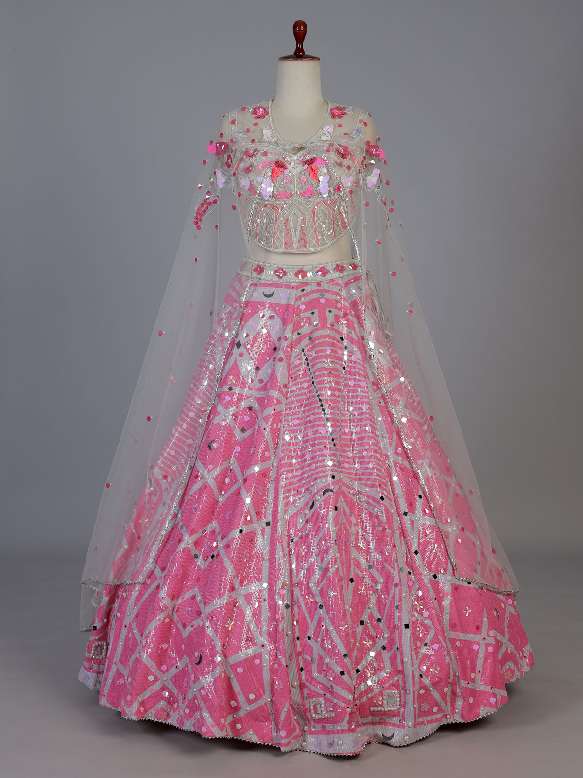 Pink silk cape style designer lehenga ensemble