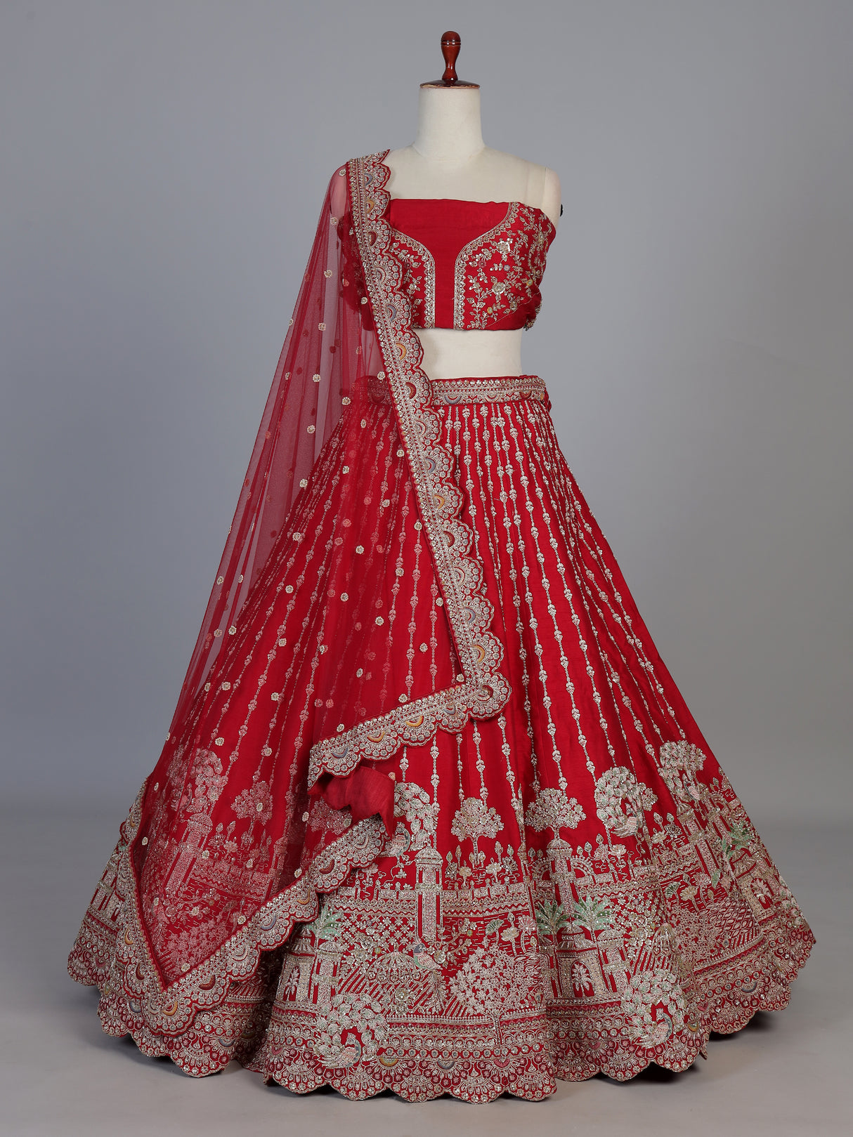 Red raw silk bridal unstitched lehenga choli with zardosi embellishments