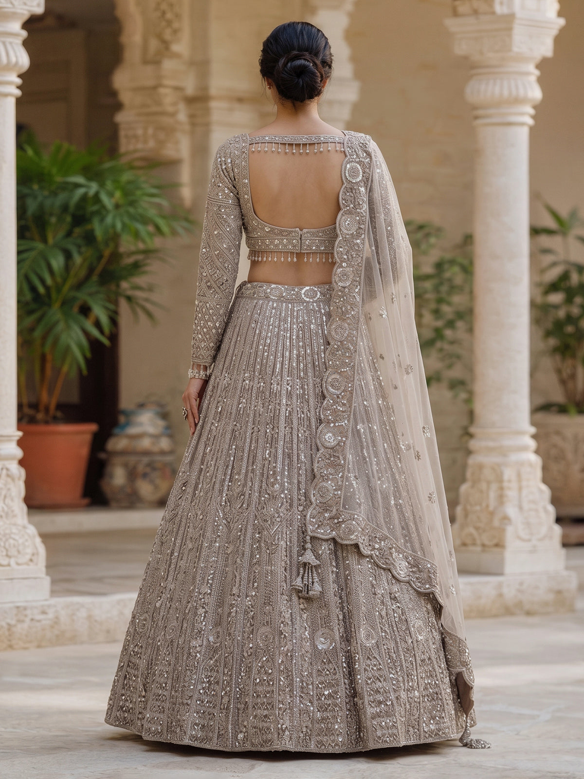Beige net designer lehenga choli with diamond work embellishments