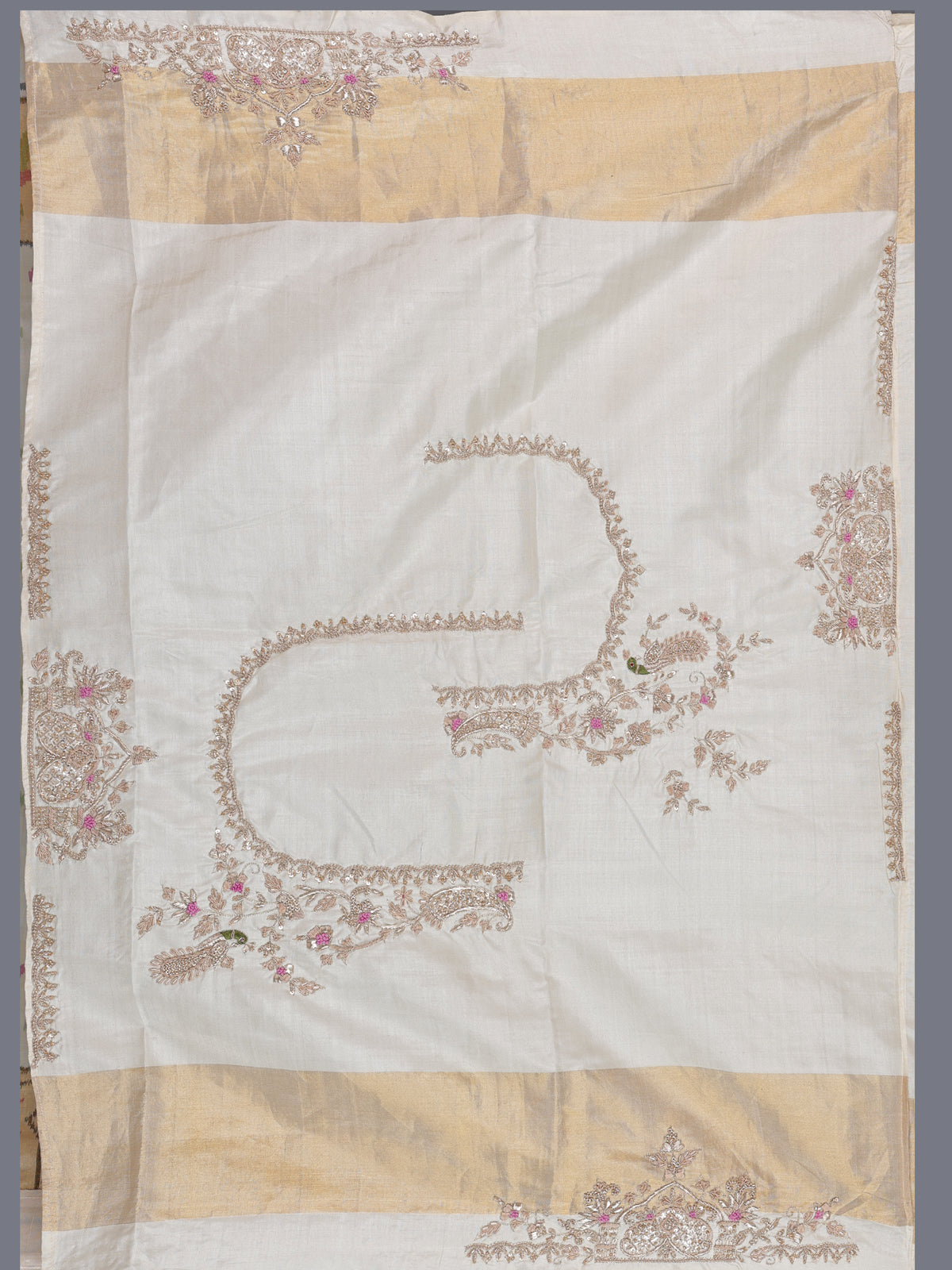 Cream patola silk saree with peacock motif contrast border and pallu