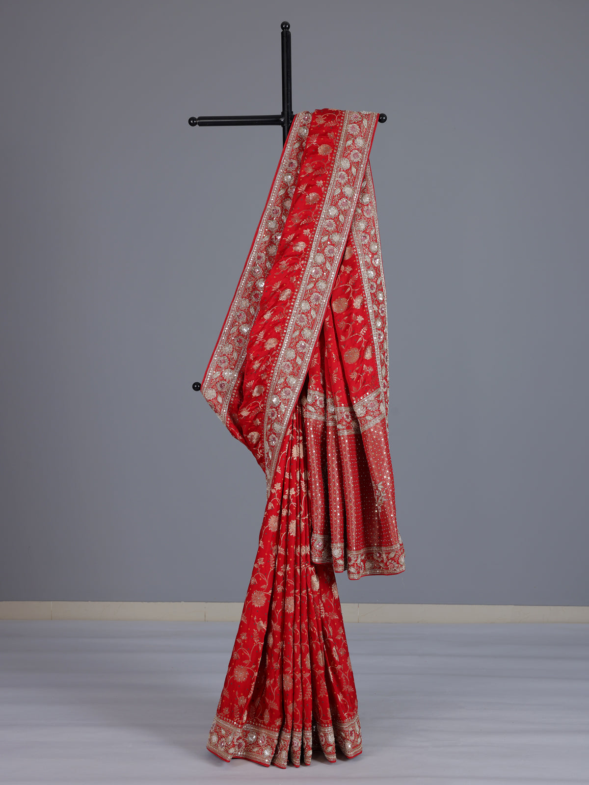 Red dola silk saree with floral zardosi and pearl zari work
