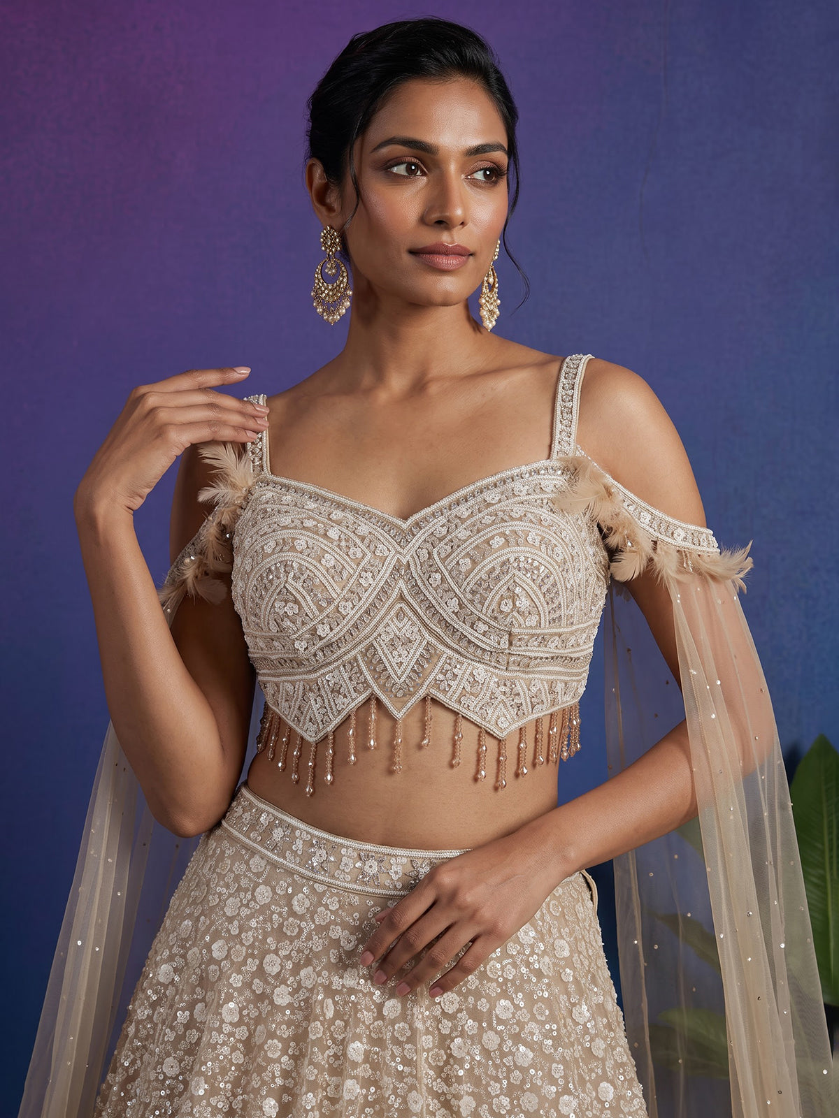 Beige net stone embellished bridal lehenga choli