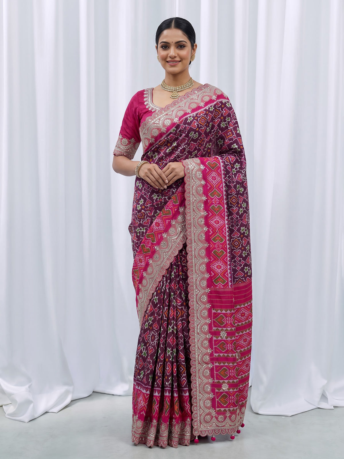 Wine Hyderabadi patola silk saree with rich hand work