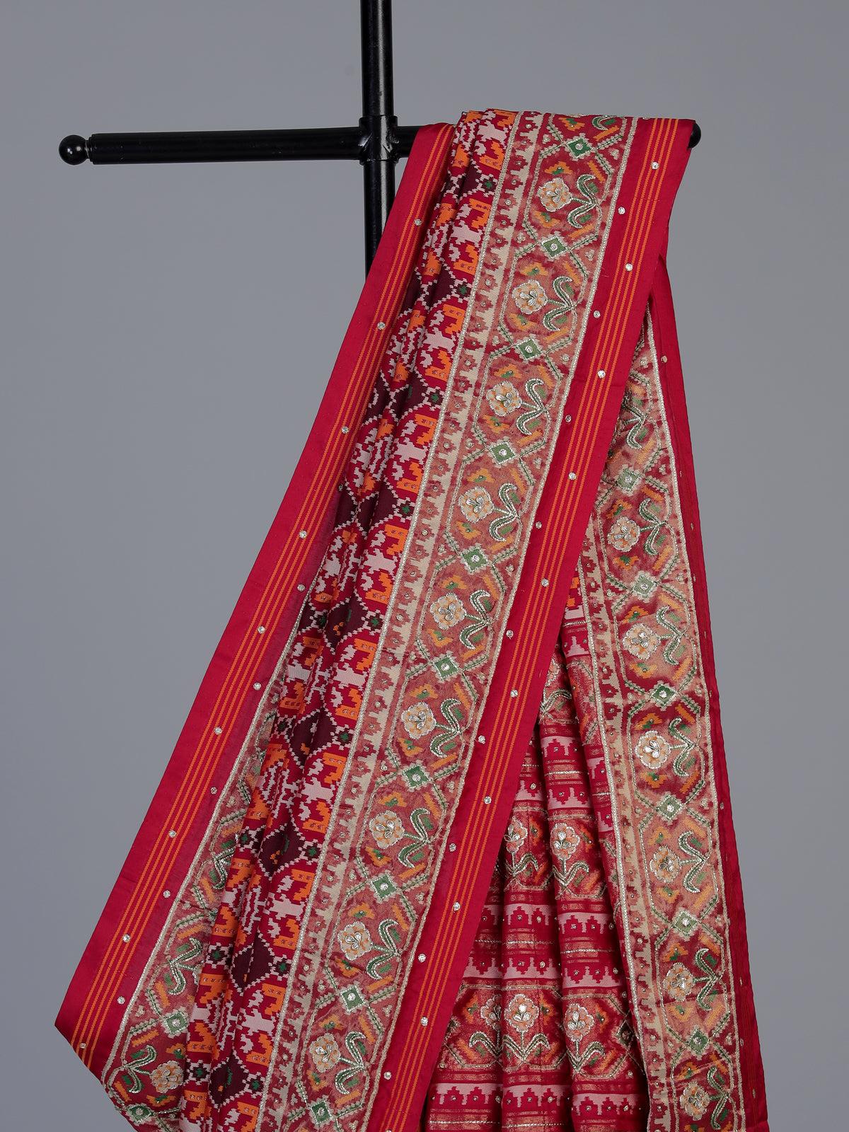 Red art patola silk saree with elegant stone work