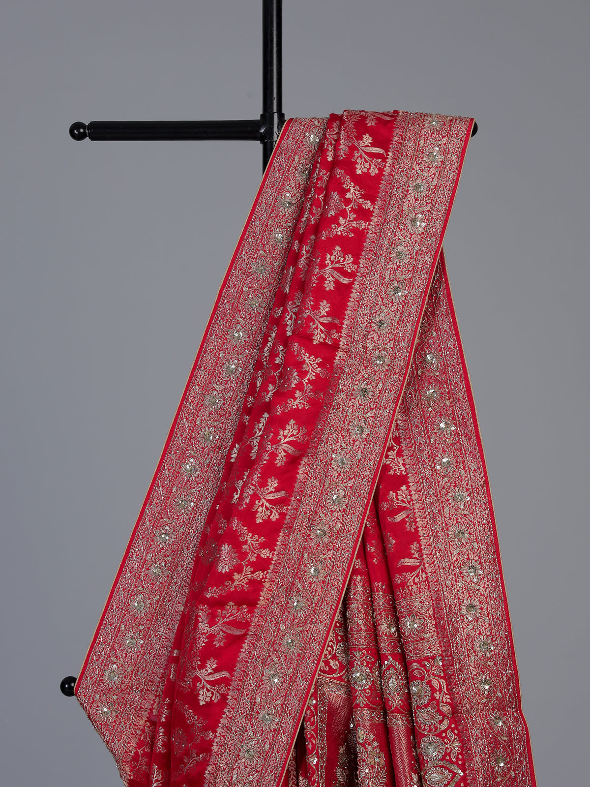 Red modal satin silk saree with bridal embellished elegance