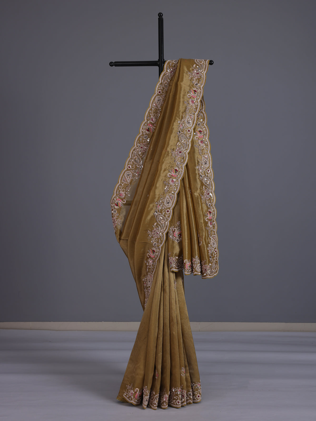 Gold tissue silk saree with bird motif border embellishments