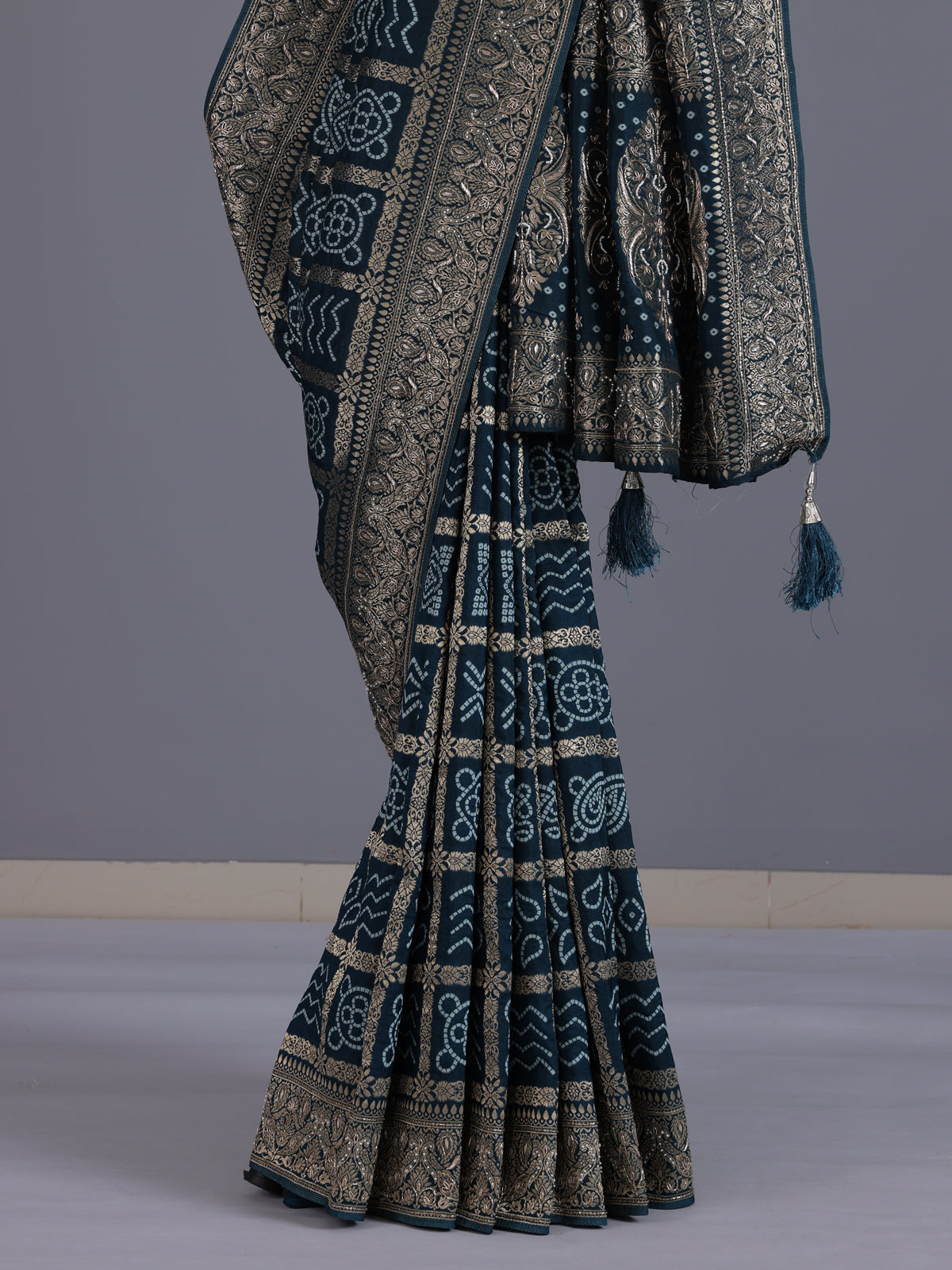 Peacock green dola silk bandhani saree with tassel pallu elegance