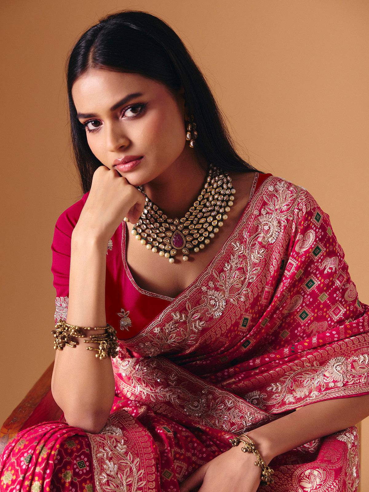 Deep pink georgette bridal saree with zardosi embellished elegance