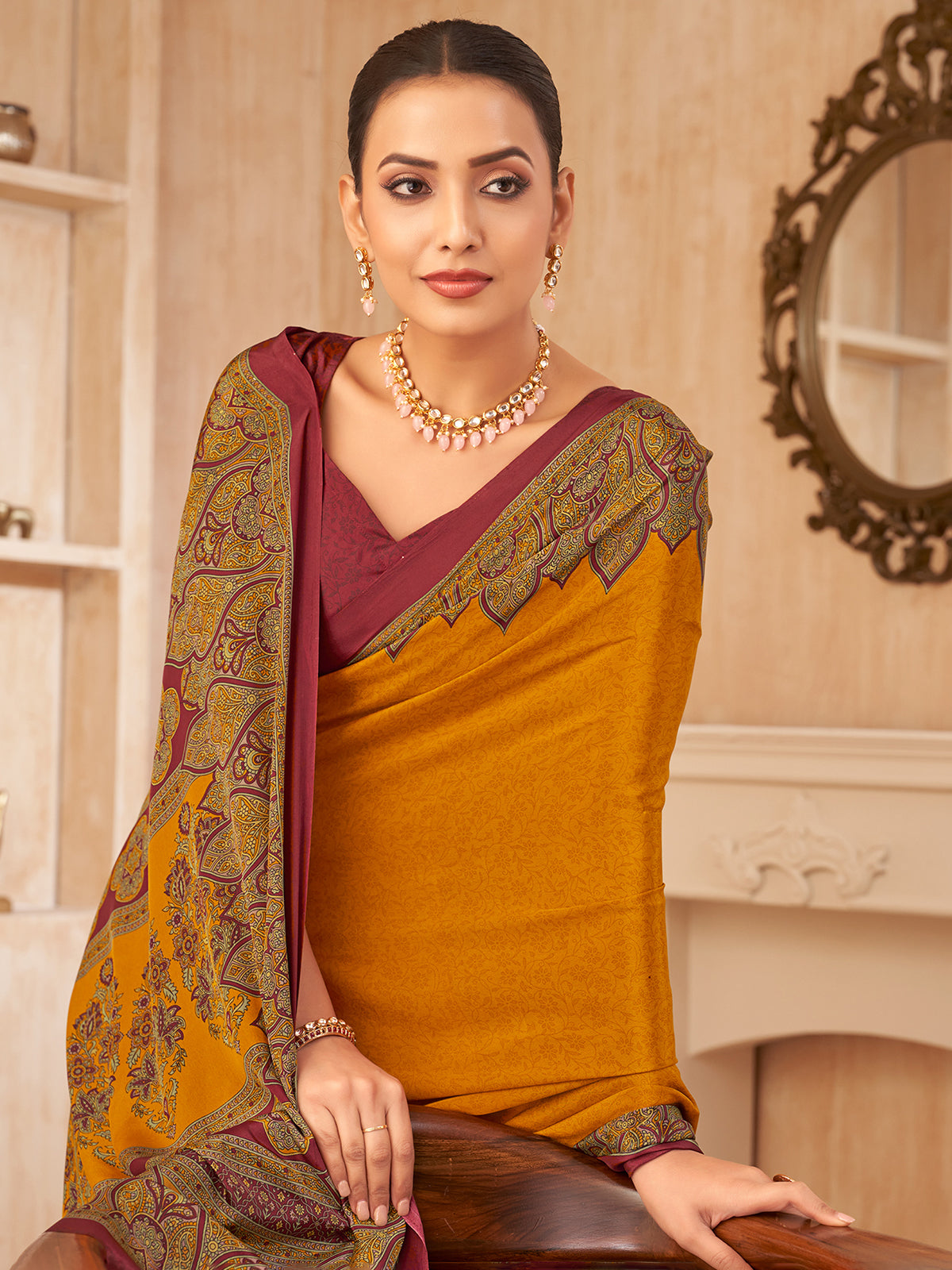 Mustard yellow printed contrast border crepe silk saree