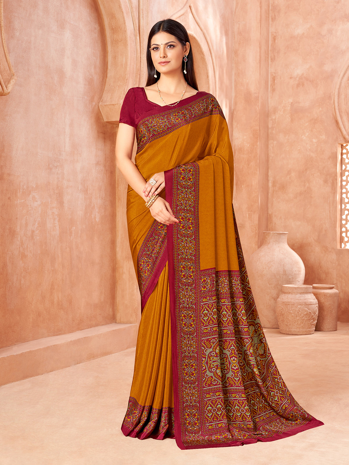 Mustard yellow printed contrast border and pallu crepe silk saree