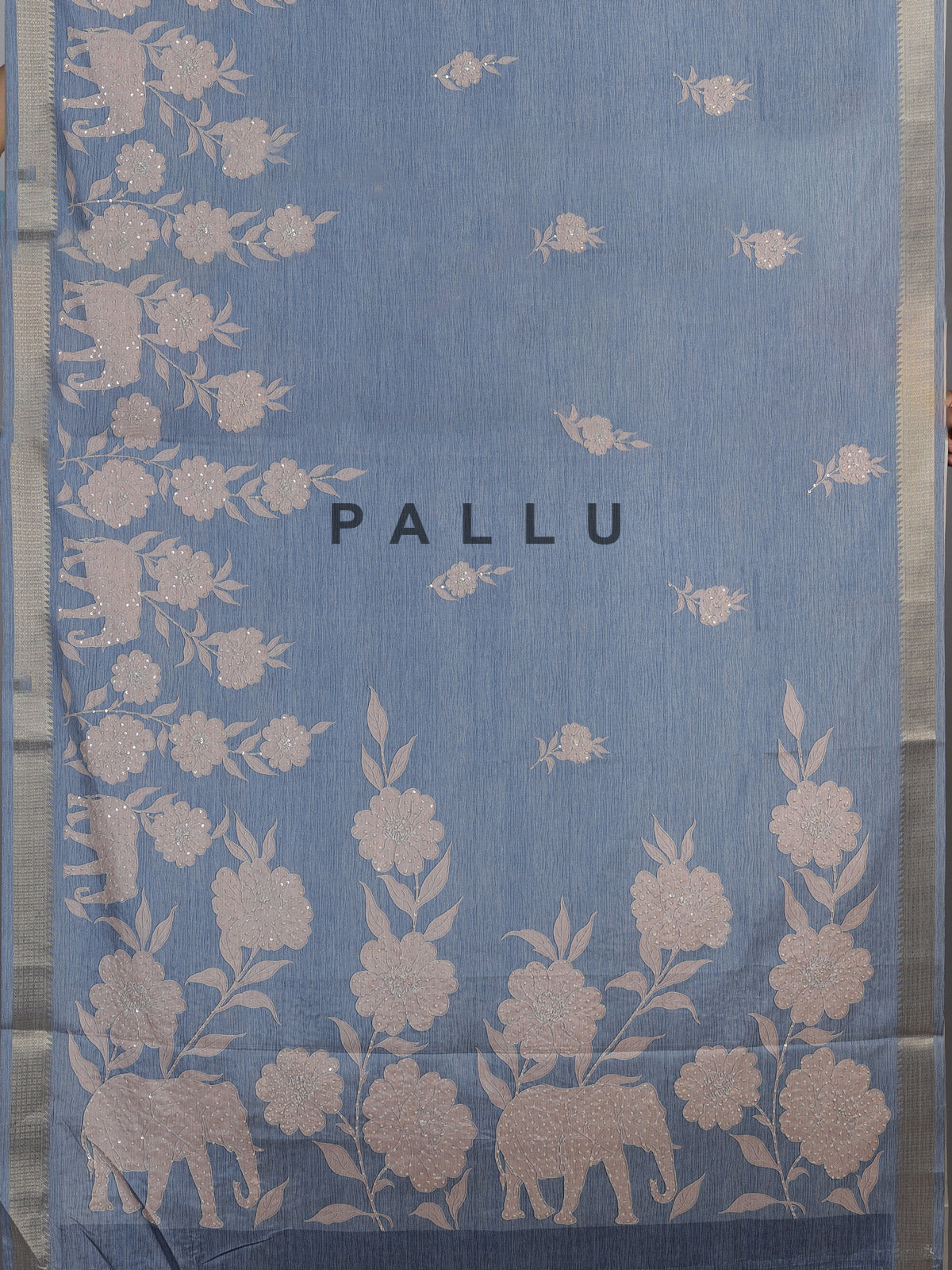 Stone blue art silk saree with floral and elephant motif detailing