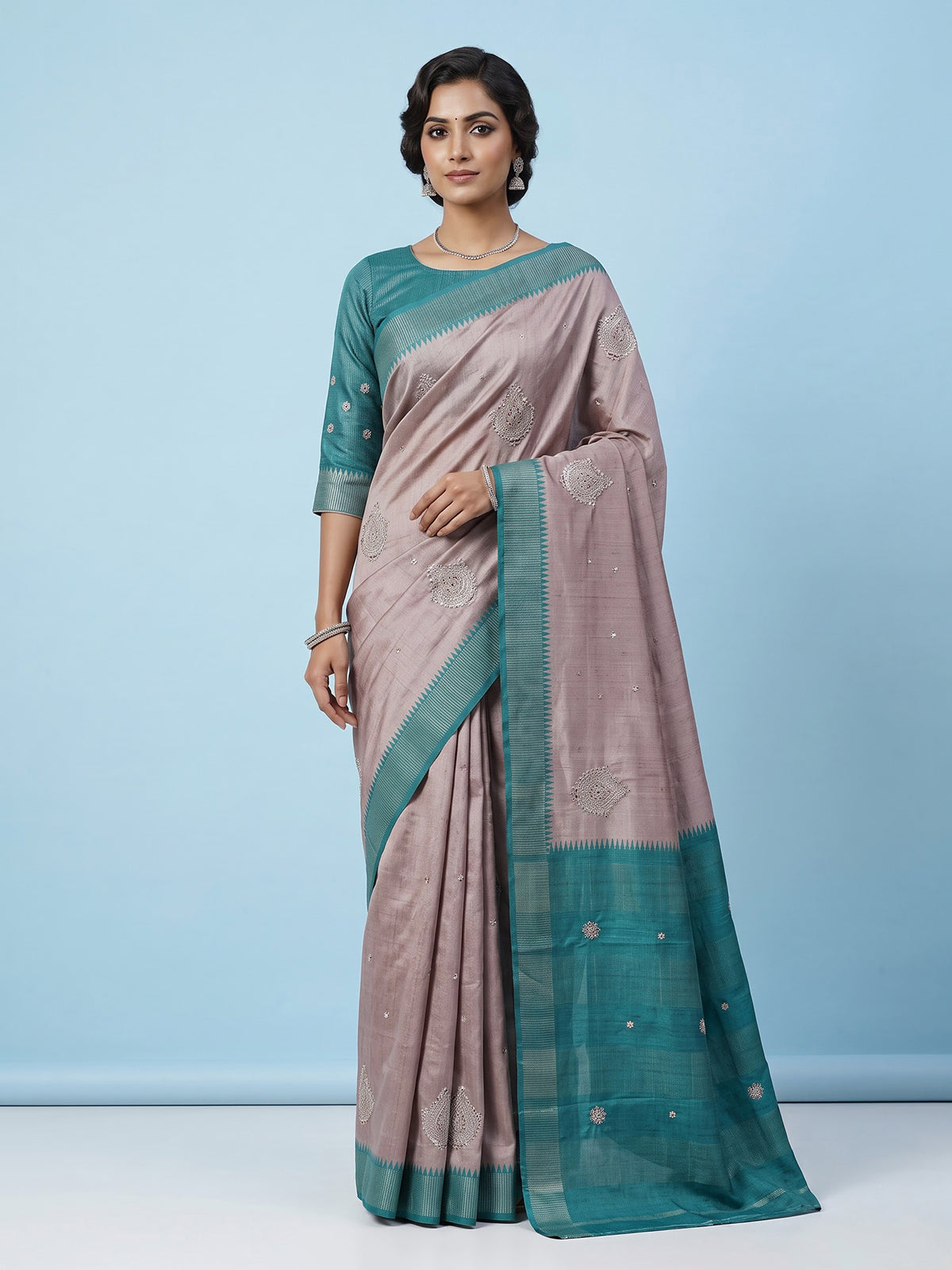 Beige tusser silk saree with regal zari border detailing