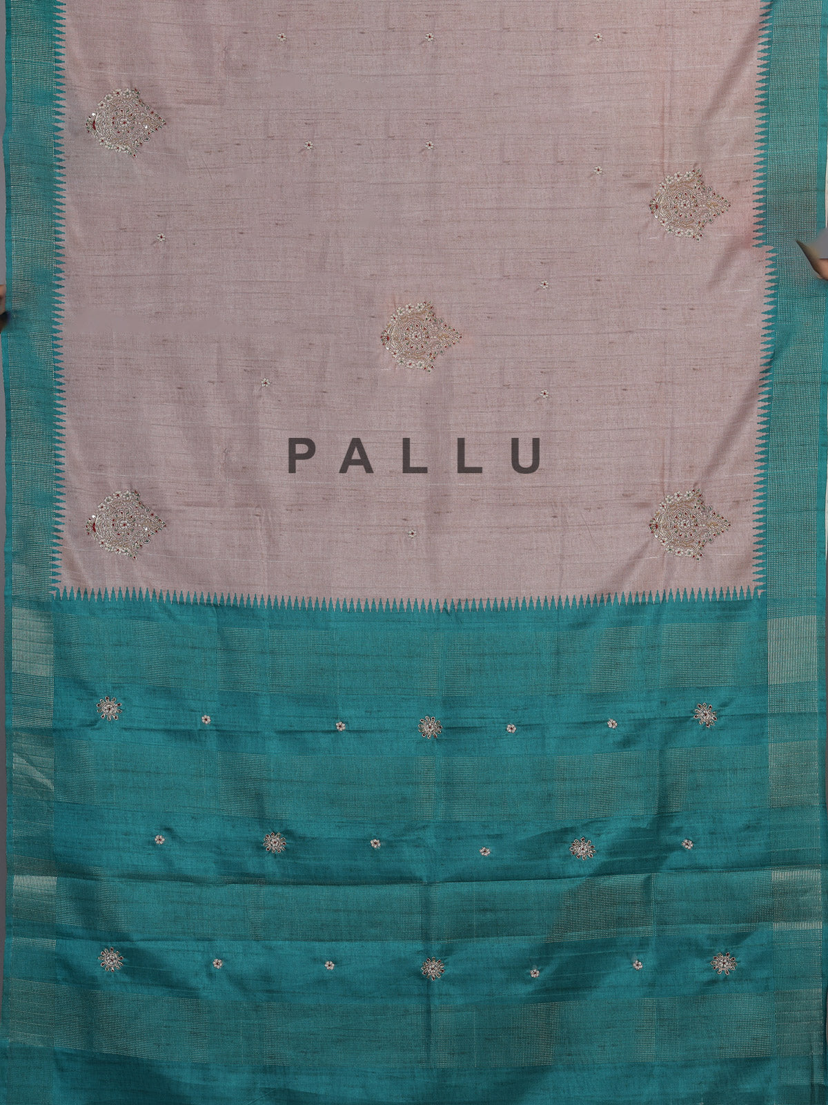 Beige tusser silk saree with regal zari border detailing