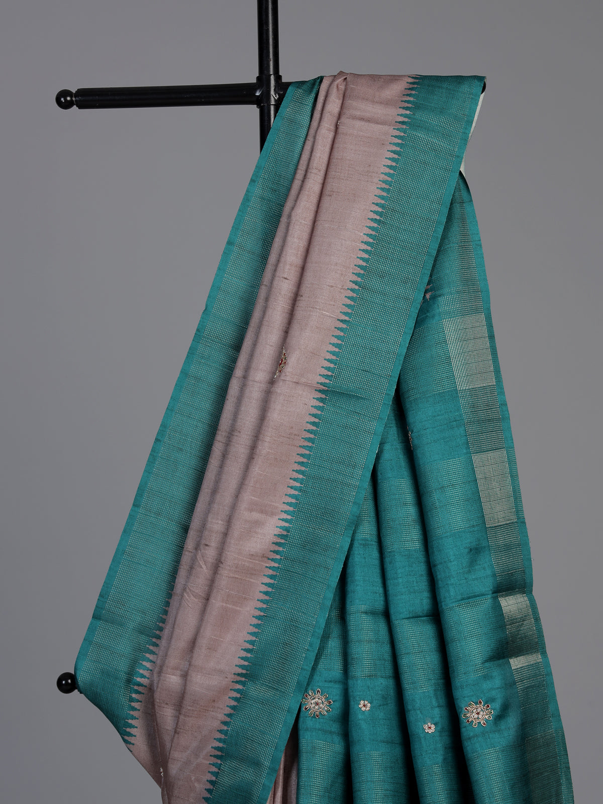 Beige tusser silk saree with regal zari border detailing