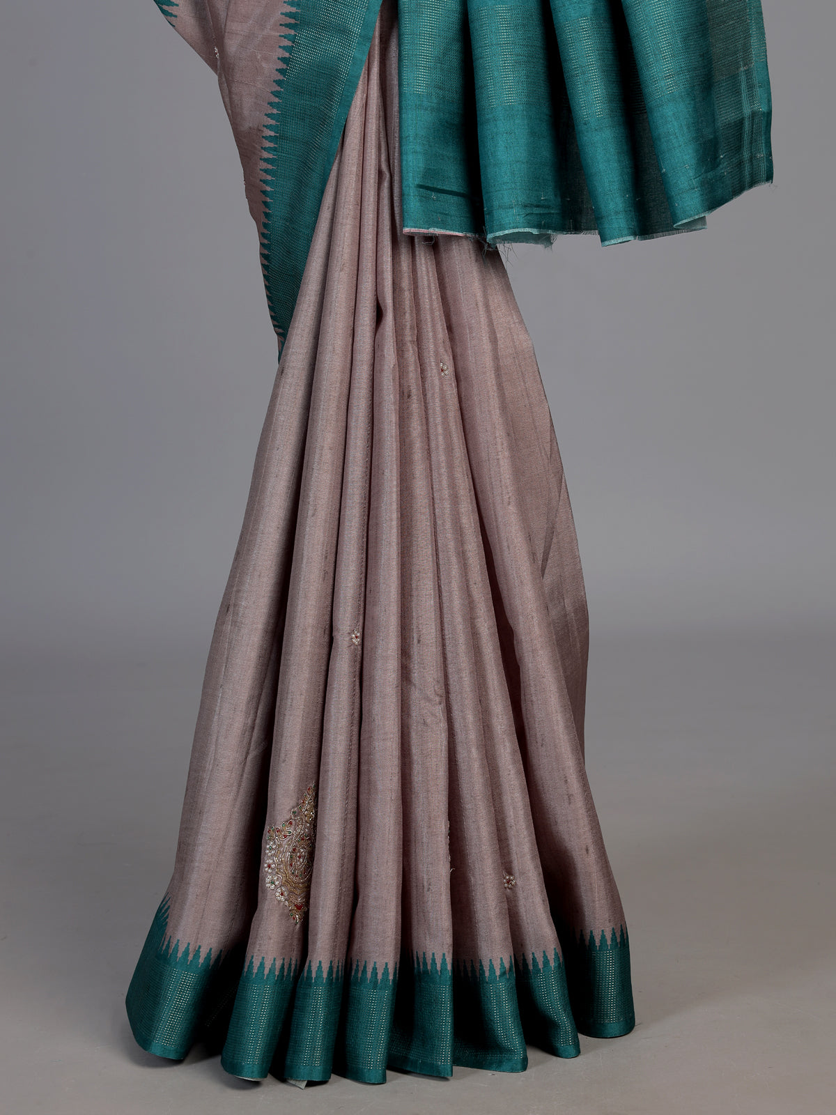 Beige tusser silk saree with regal zari border detailing