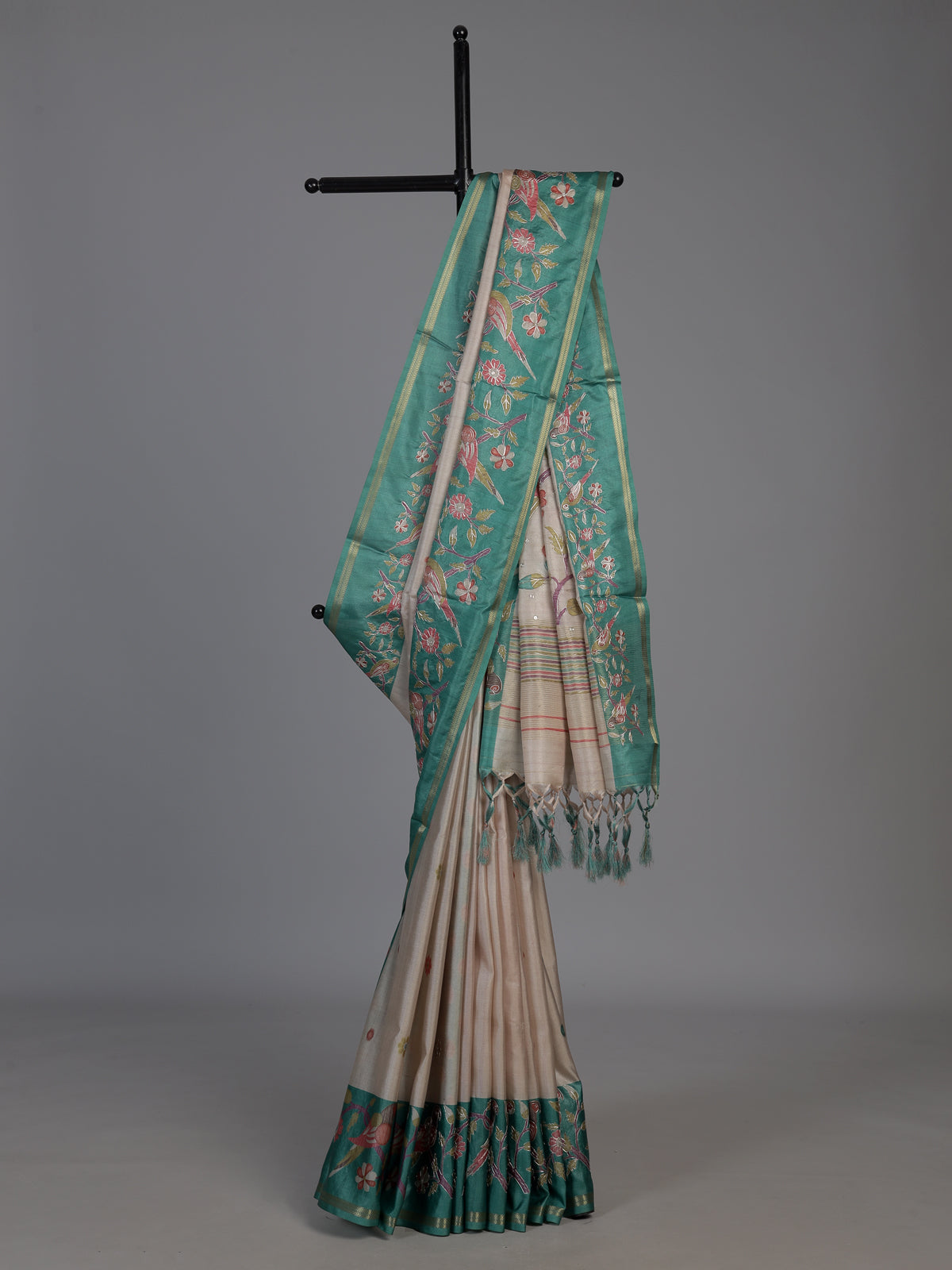 Beige and green art tusser silk saree with elegant bird motifs