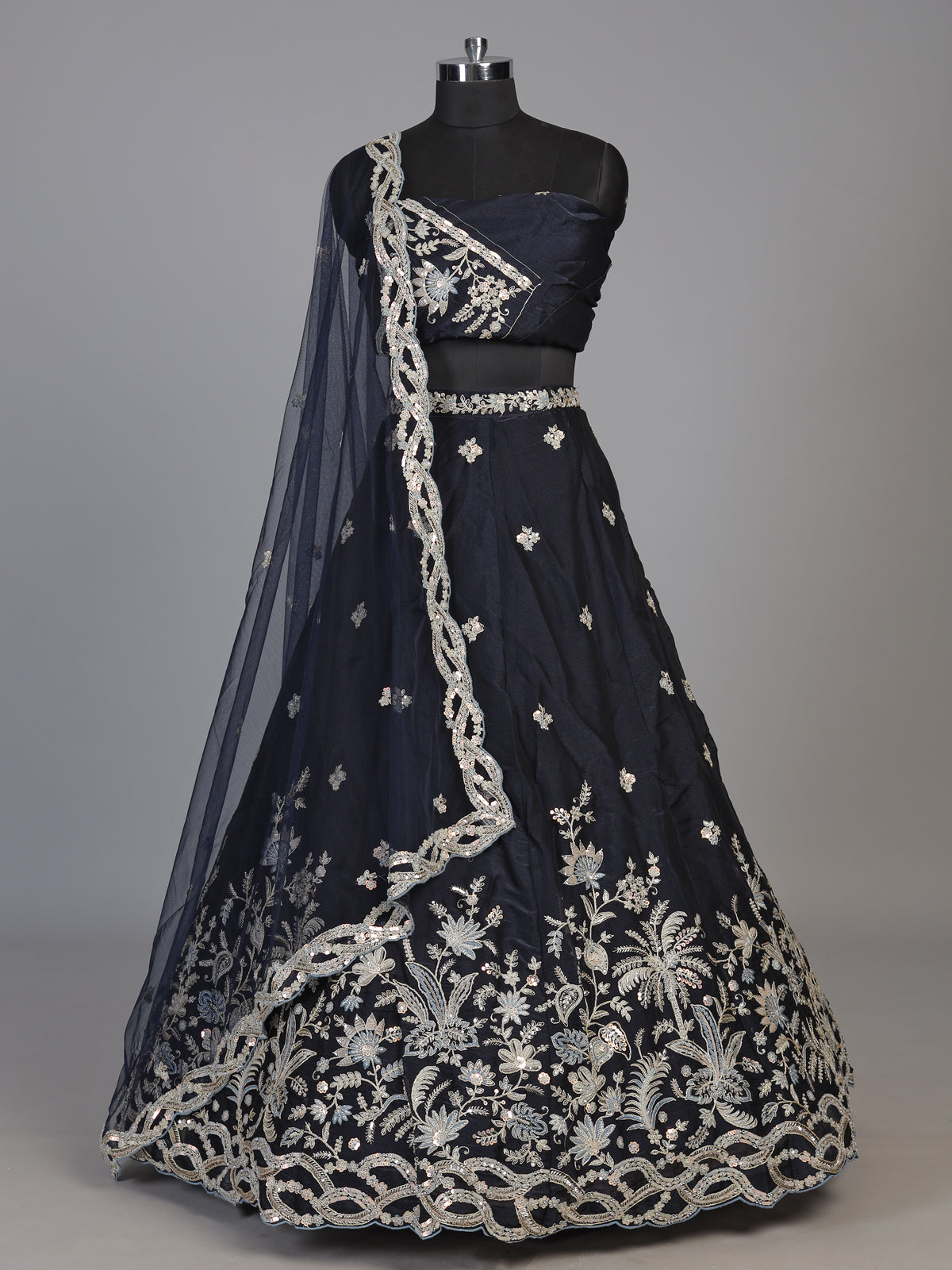 Navy blue silk lehenga choli adorned with floral stonework