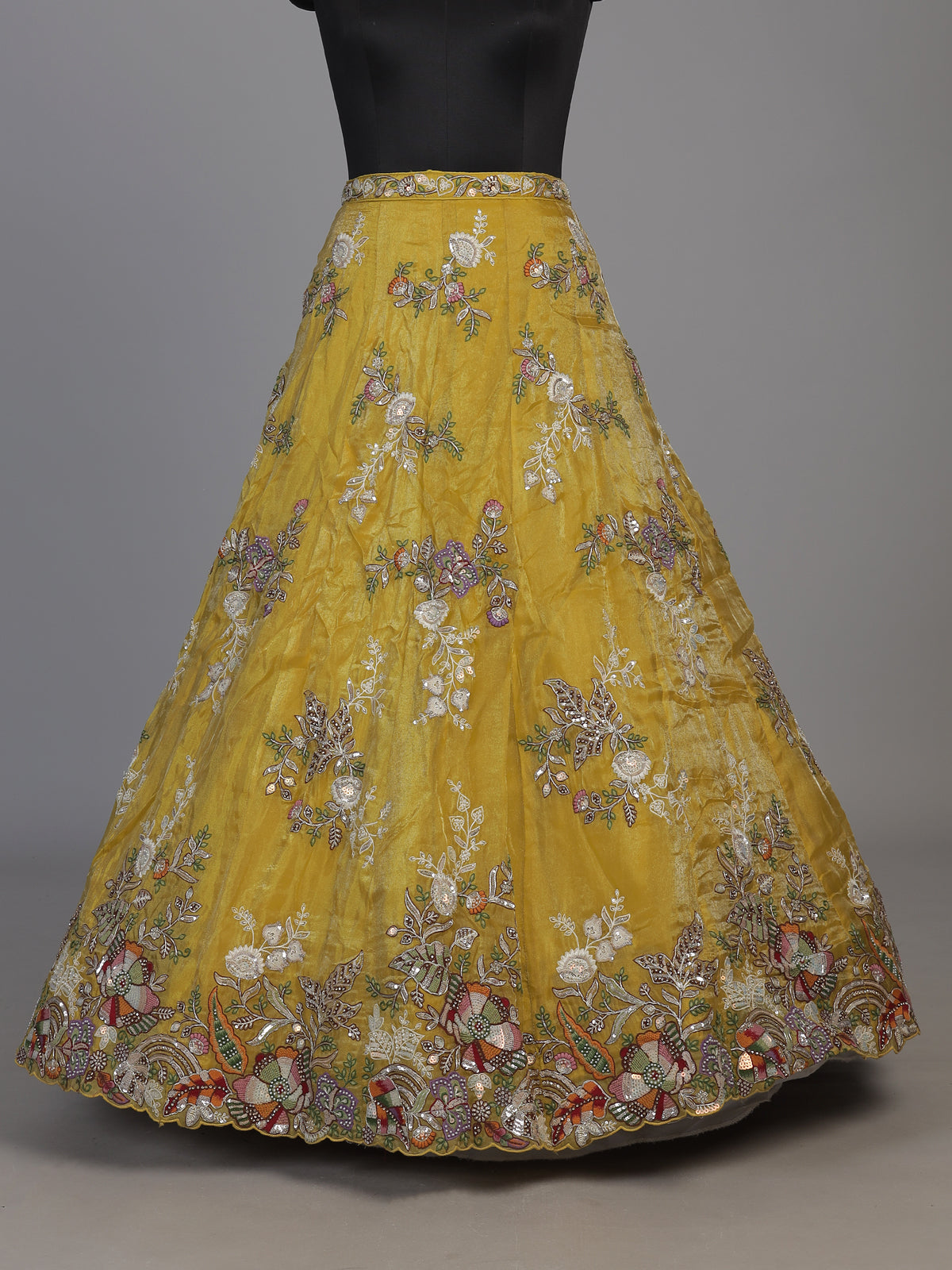 Mustard yellow tissue silk lehenga choli with dazzling embellishments