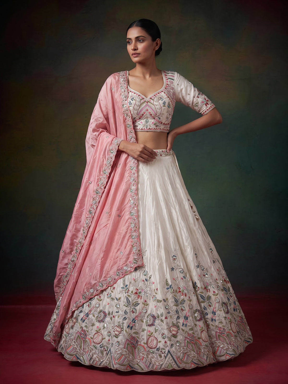 White tissue silk lehenga choli featuring exquisite zardosi embellishments