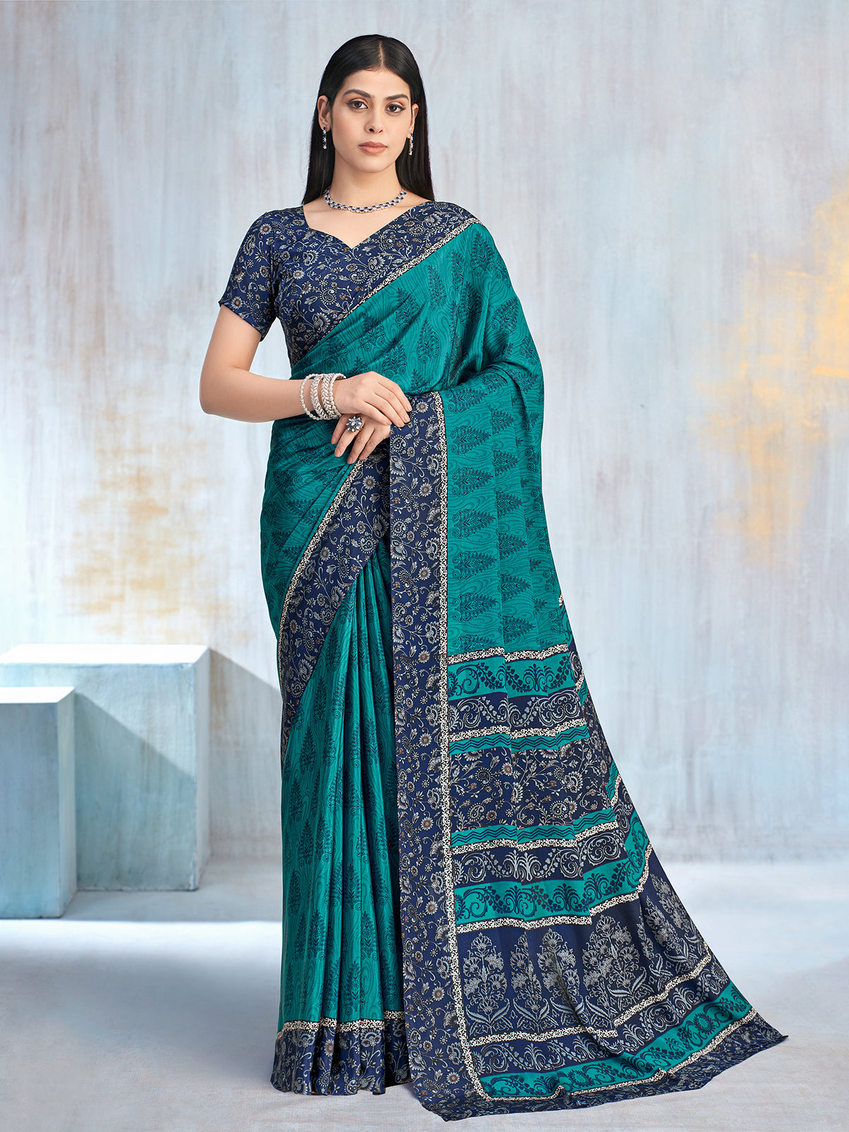 Rama green floral printed contrast border and pallu saree