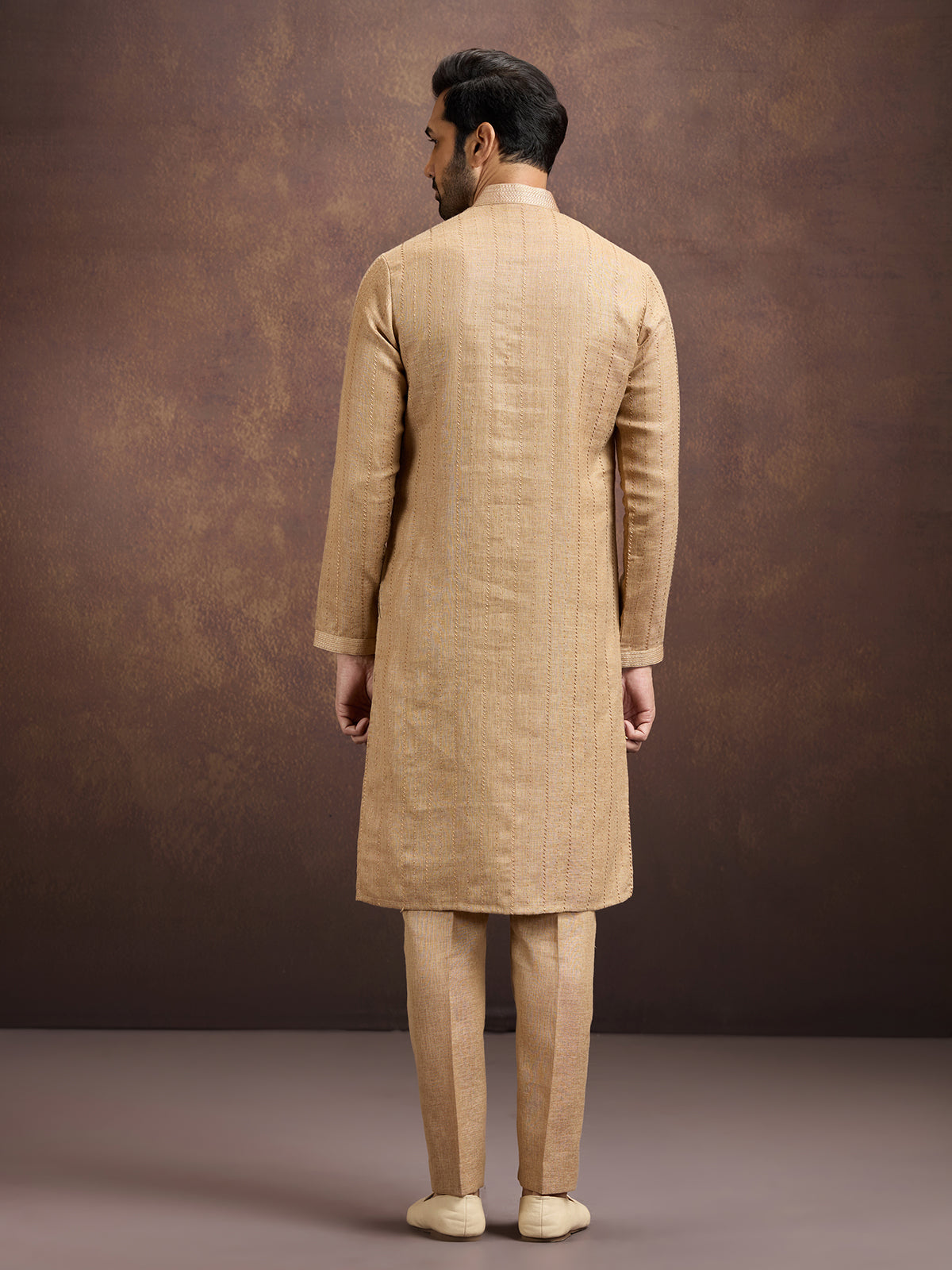 Gold graceful embroidered linen kurta pajama attire