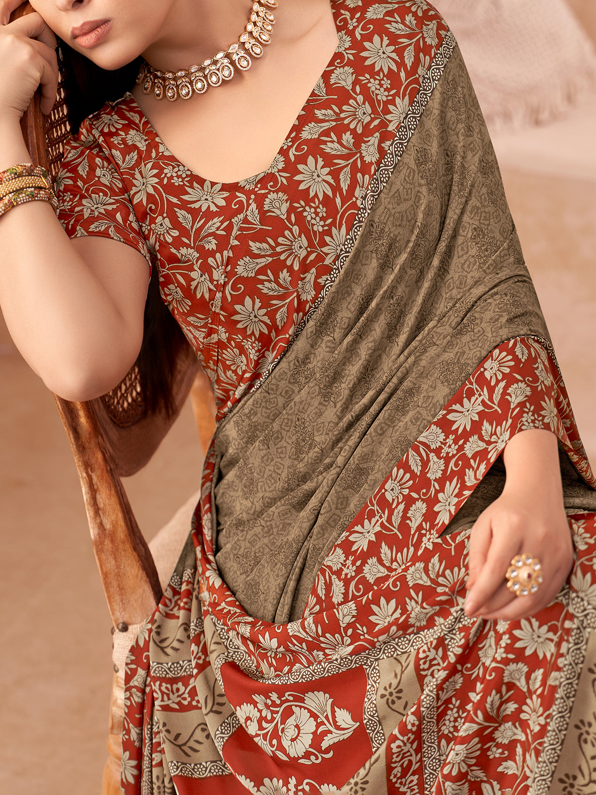 Brown printed crepe silk saree with unstitched blouse