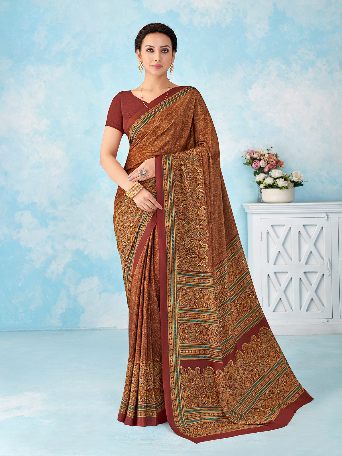 Rust orange printed crepe silk saree