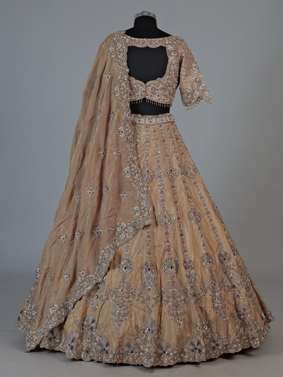 Beige silk lehenga choli with shimmering diamond stone embellishments
