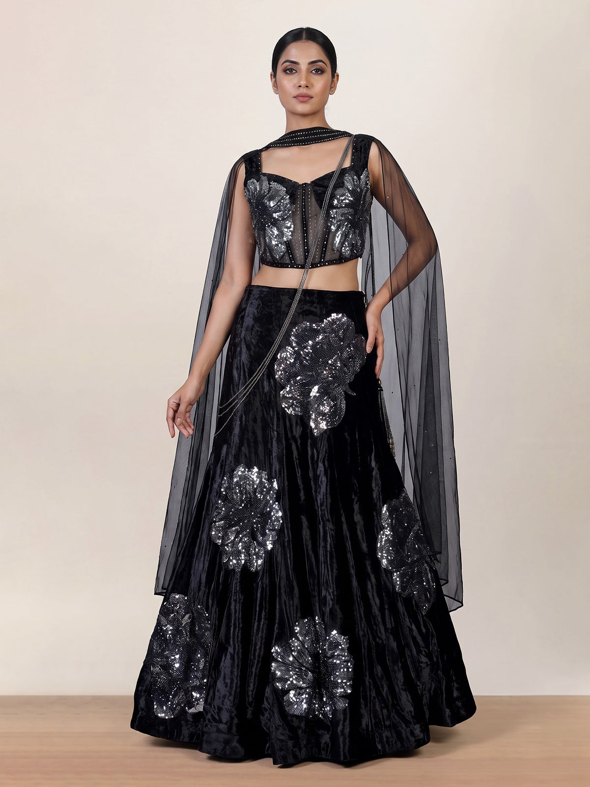Black velvet lehenga choli with cutdana and pearl embellishments