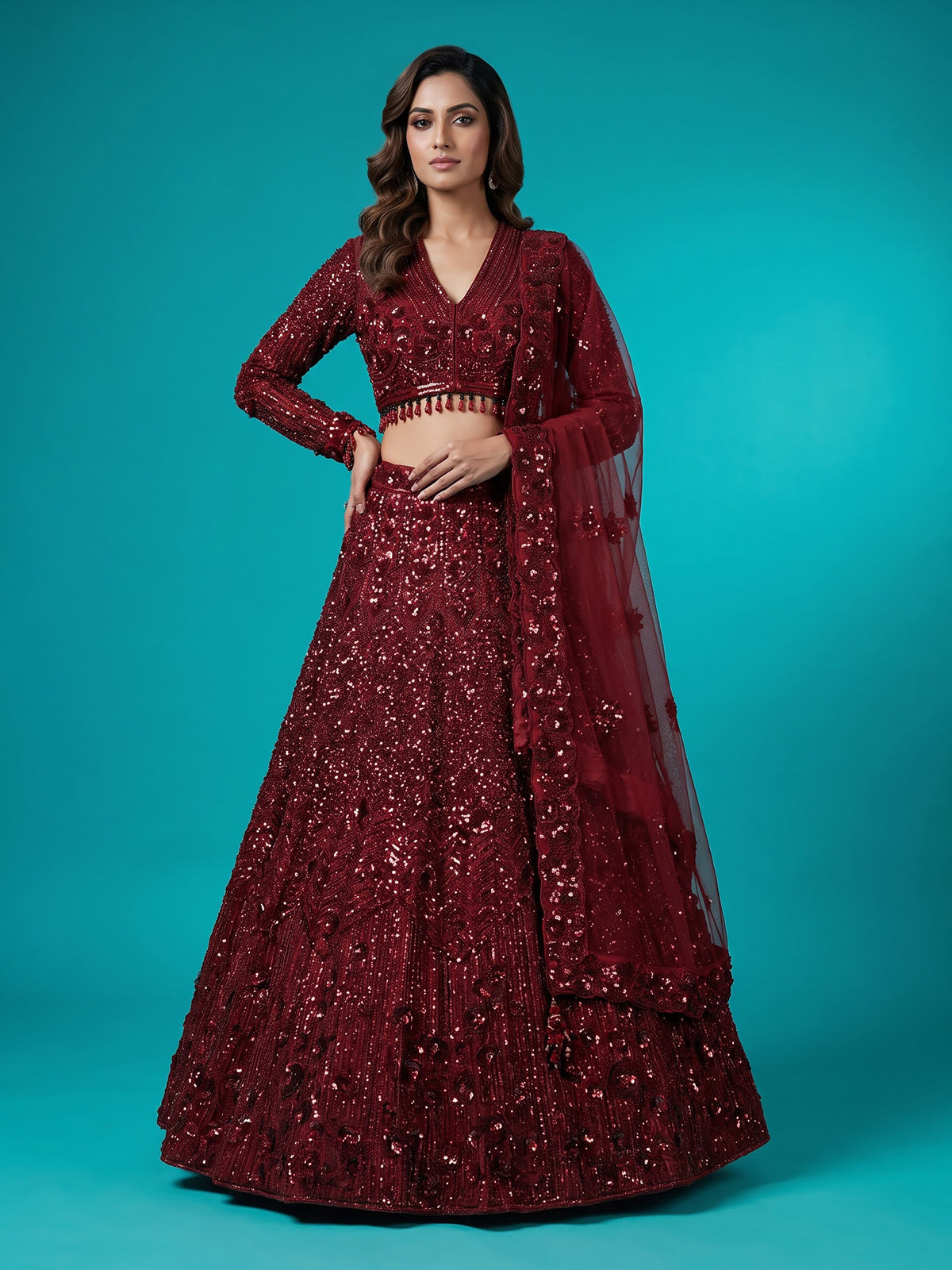 Maroon net lehenga choli with luxurious pearl cutdana embellishments