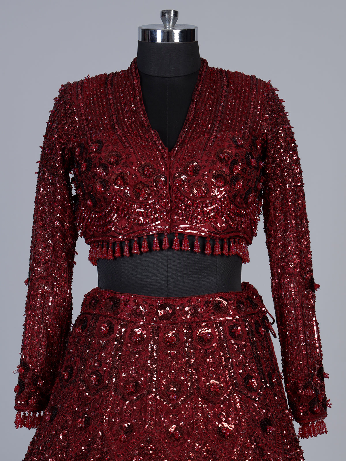 Maroon net lehenga choli with luxurious pearl cutdana embellishments