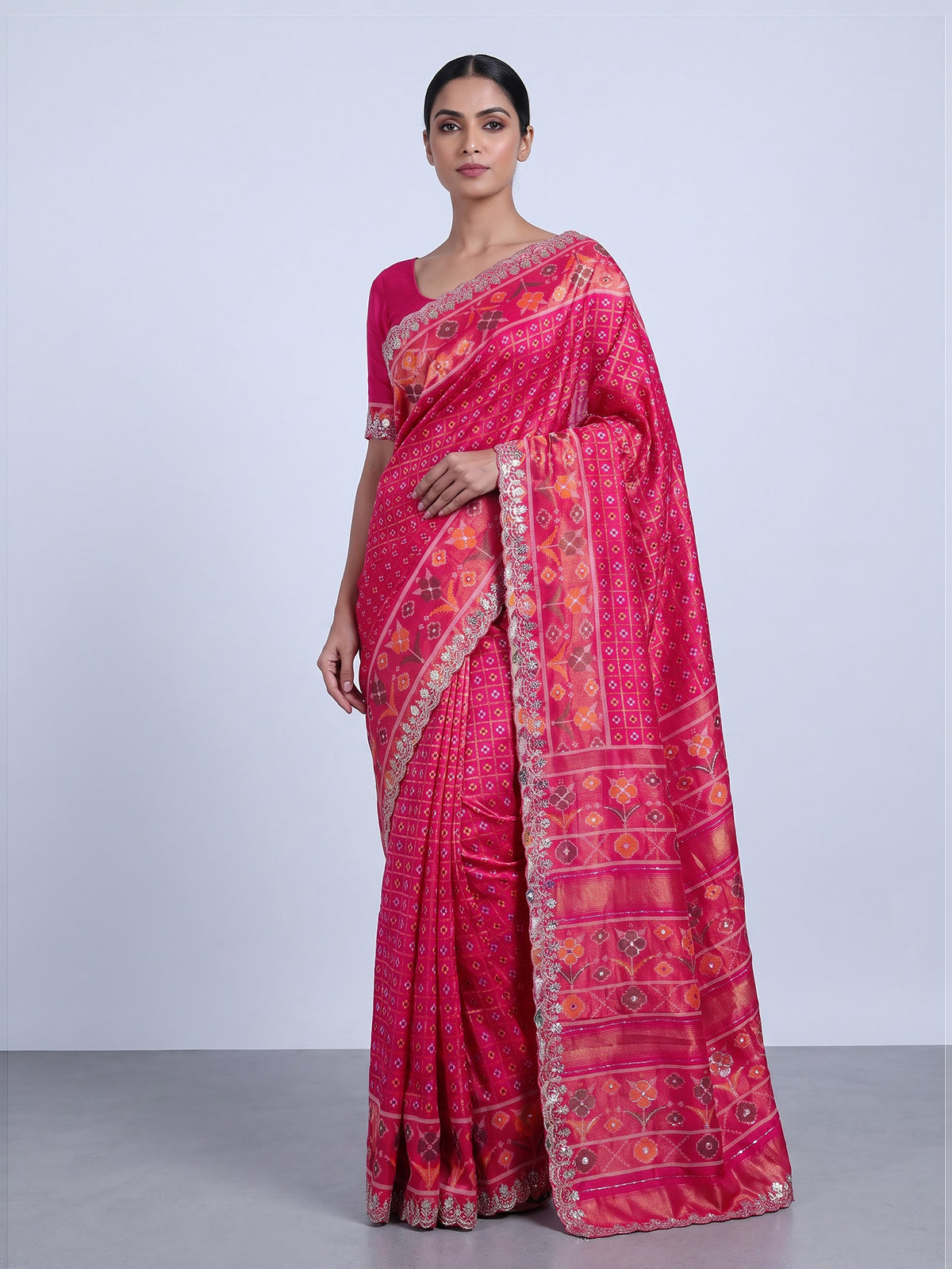 Rani pink soft silk saree with vibrant ikat printed elegance