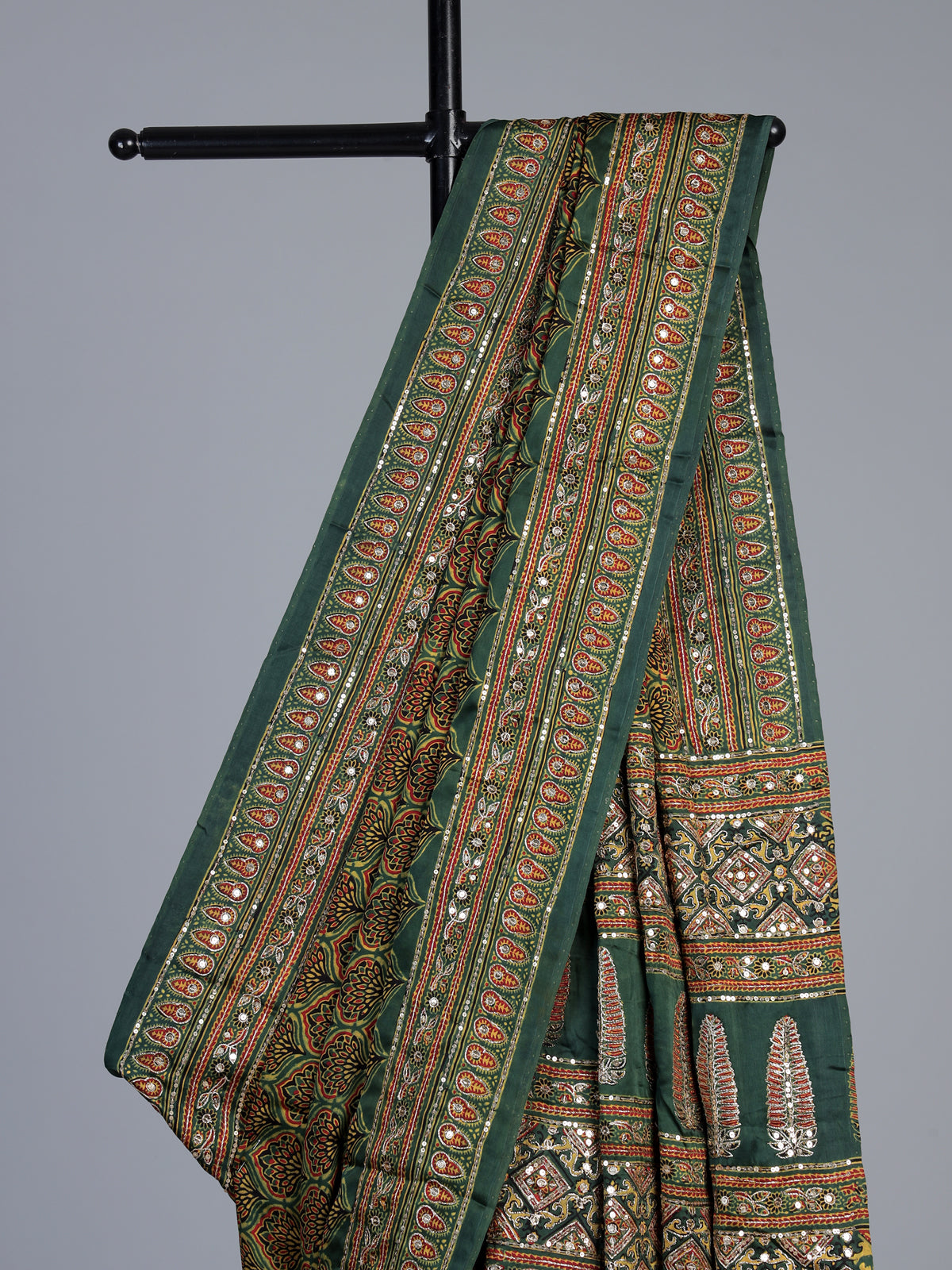 Green crepe silk saree with graceful printed festive detailing