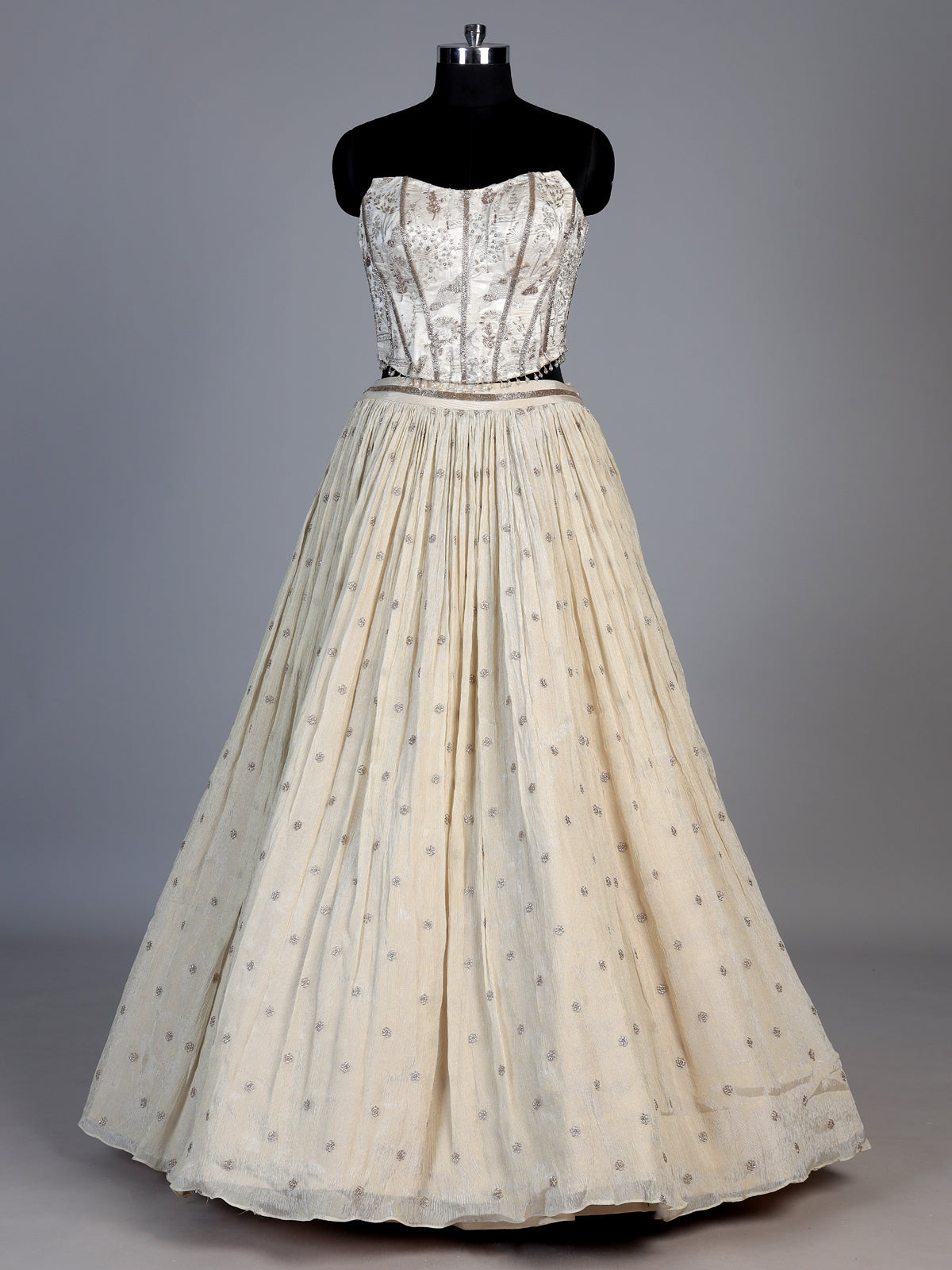 Beige chiffon silk lehenga choli with refined resham embellishments