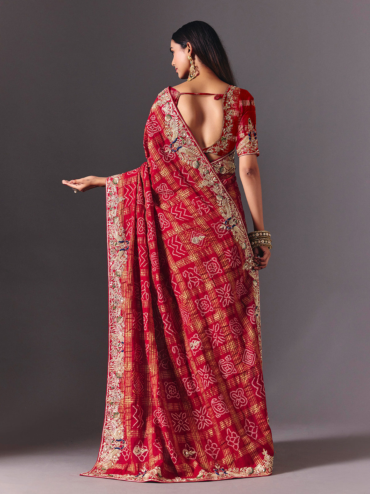 Maroon gharchola silk saree with peacock motif embellishments