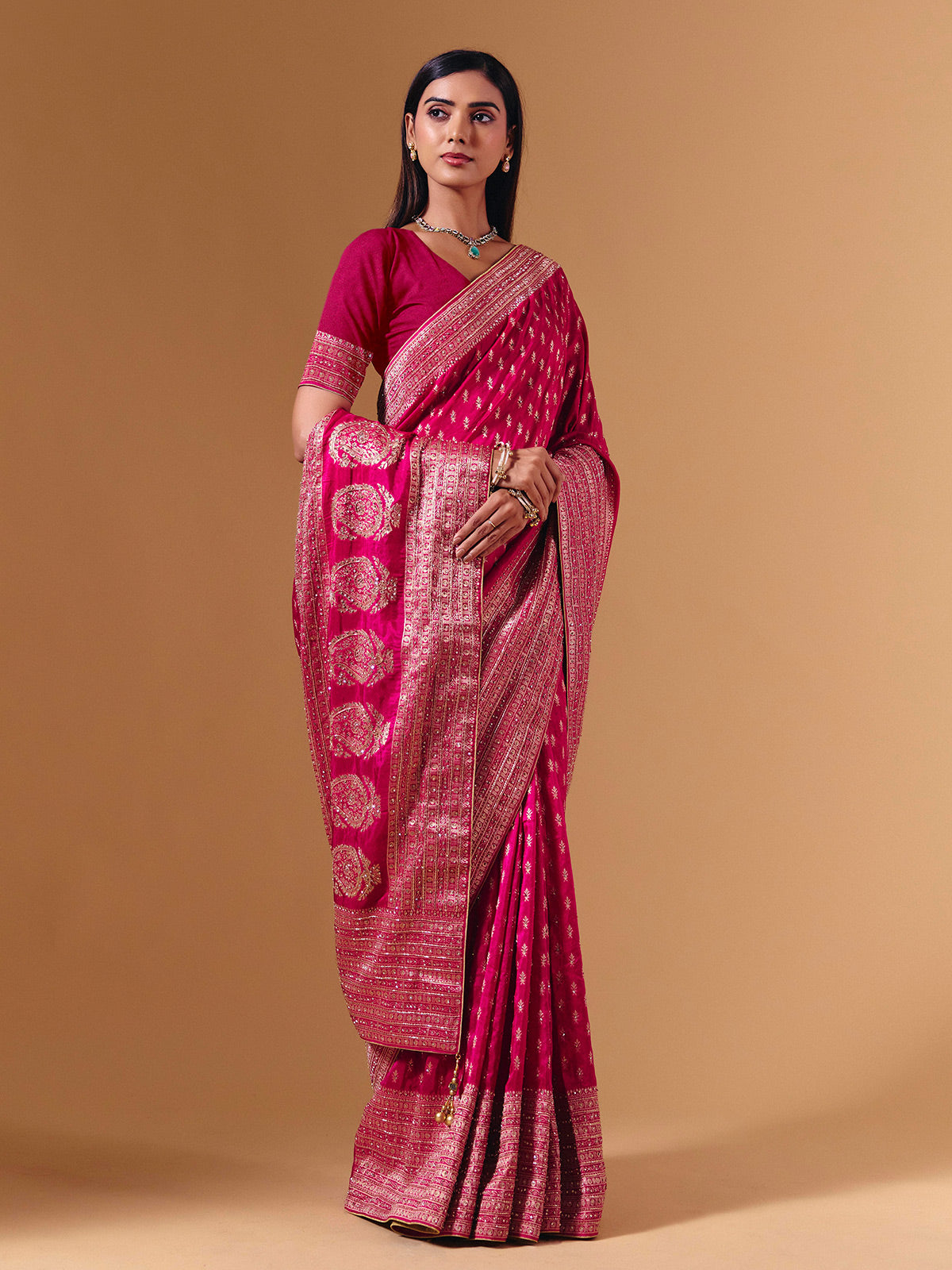 Rani pink dola silk saree with elegant zari butti work
