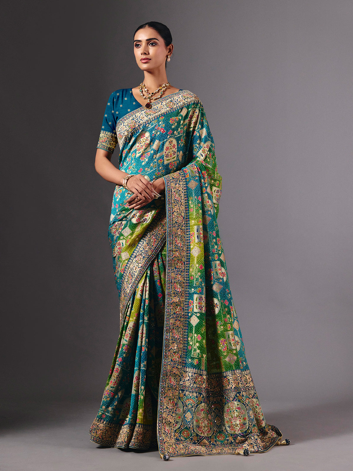 Blue dola silk saree with elegant peacock motif embellishments