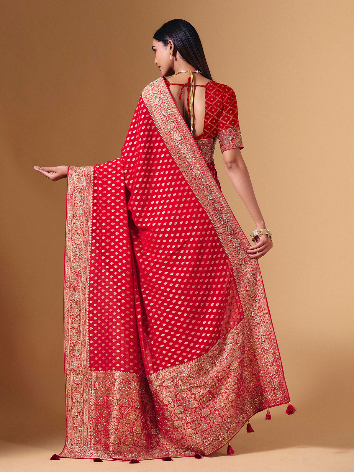 Red dola silk saree with exquisite zari butti embellishments