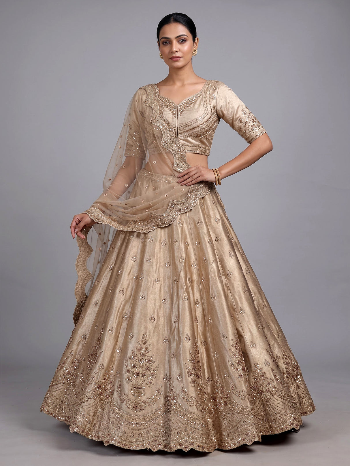 Beige silk unstitched lehenga choli with exquisite zardosi artistry