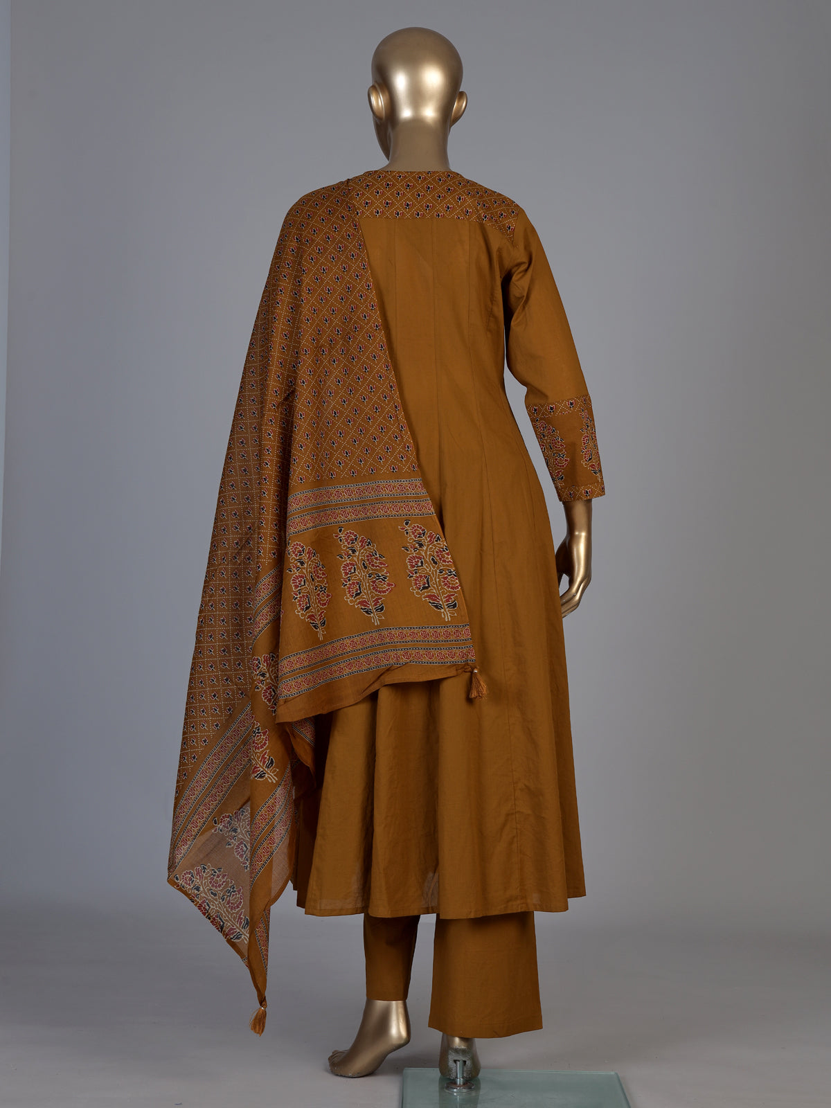 Mustard yellow cotton silk anarkali kurti set with tassel accents