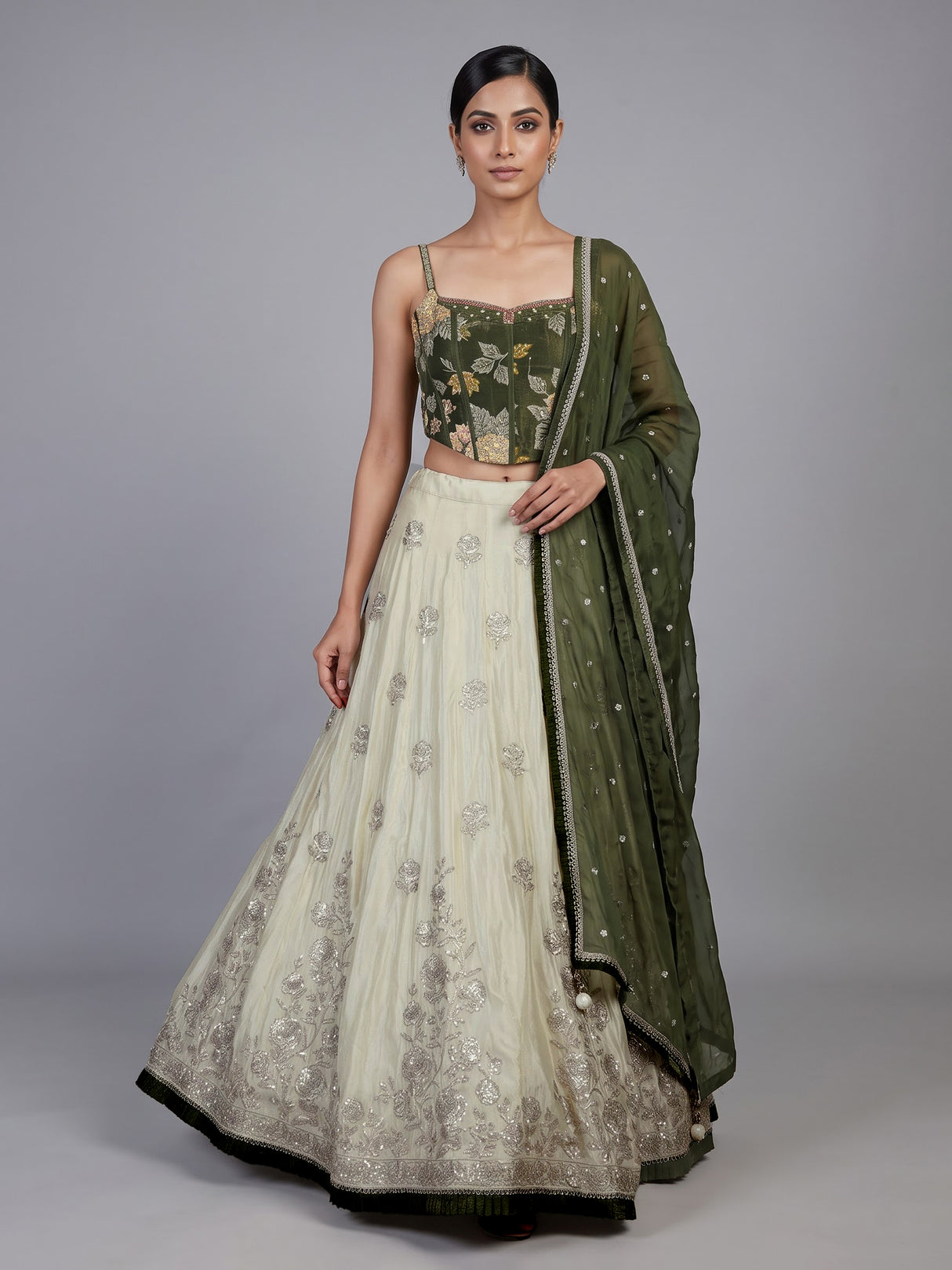 Regal mehendi green silk lehenga choli with intricate embellishments