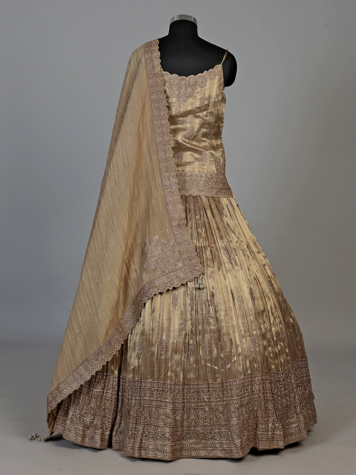 Golden zardosi embellished women’s shimmer silk lehenga choli