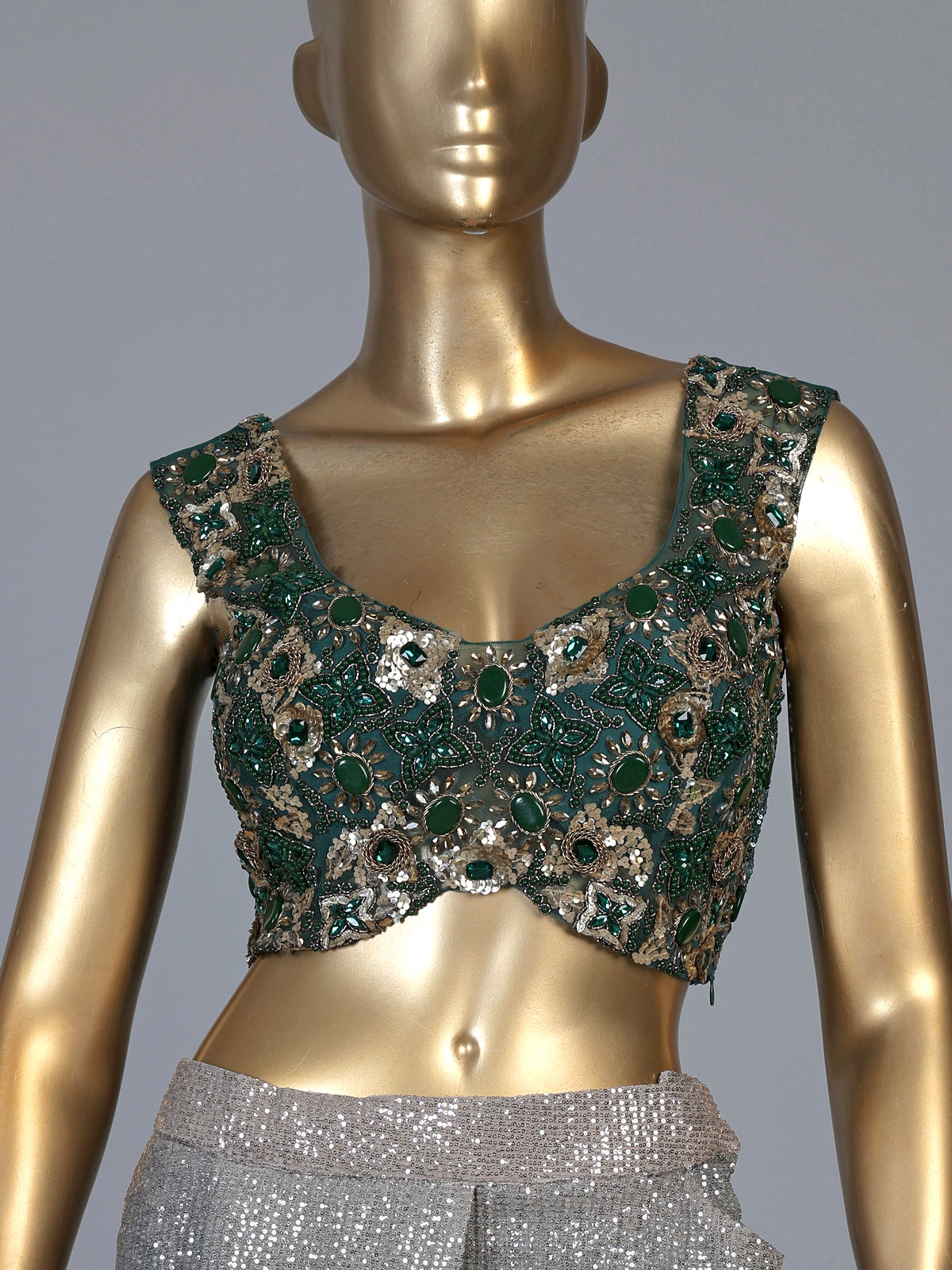 Green shaded sequin fabric saree with embellished tassel pallu