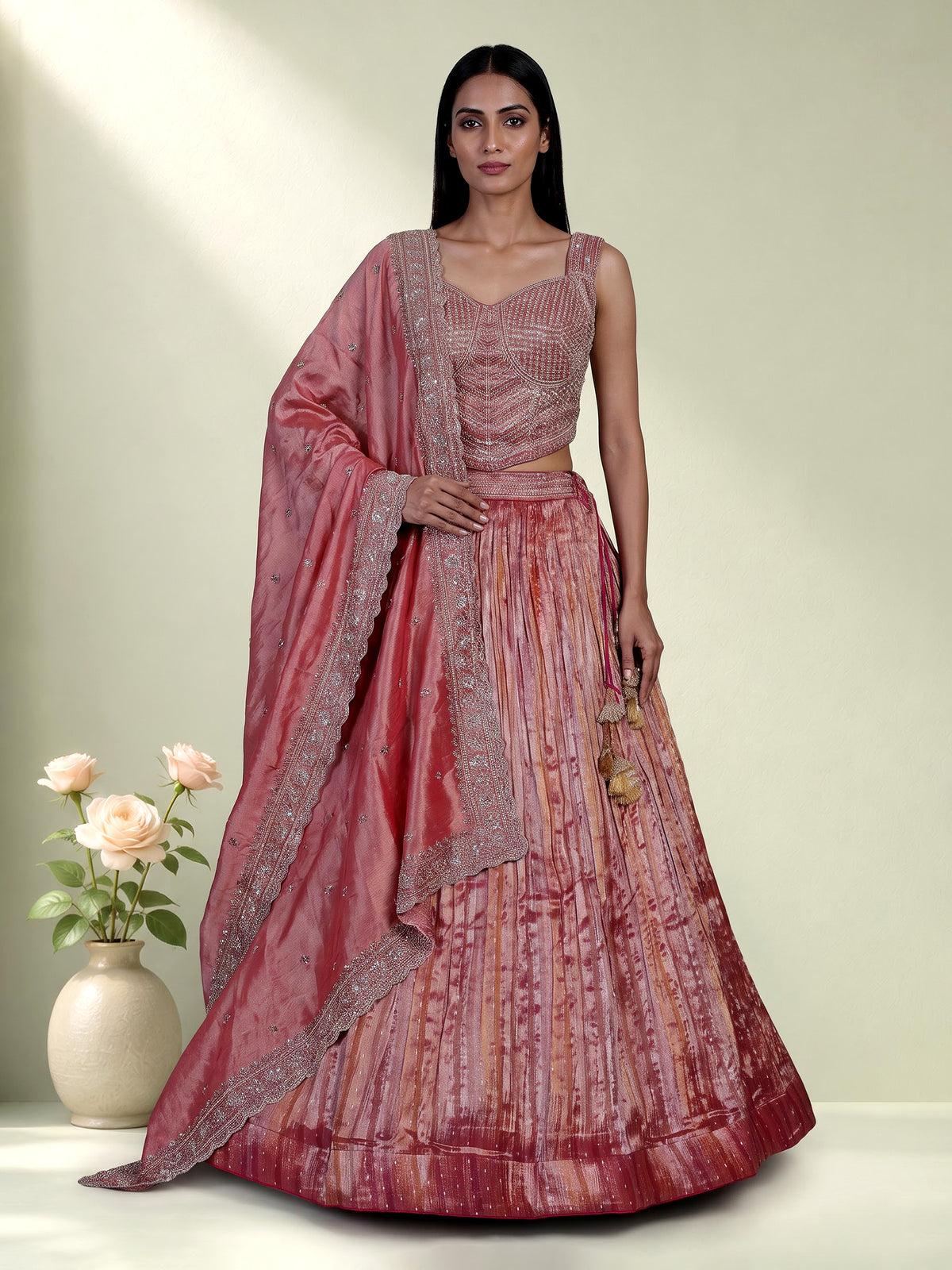 Pastel pink tissue silk lehenga choli with embellished dupatta