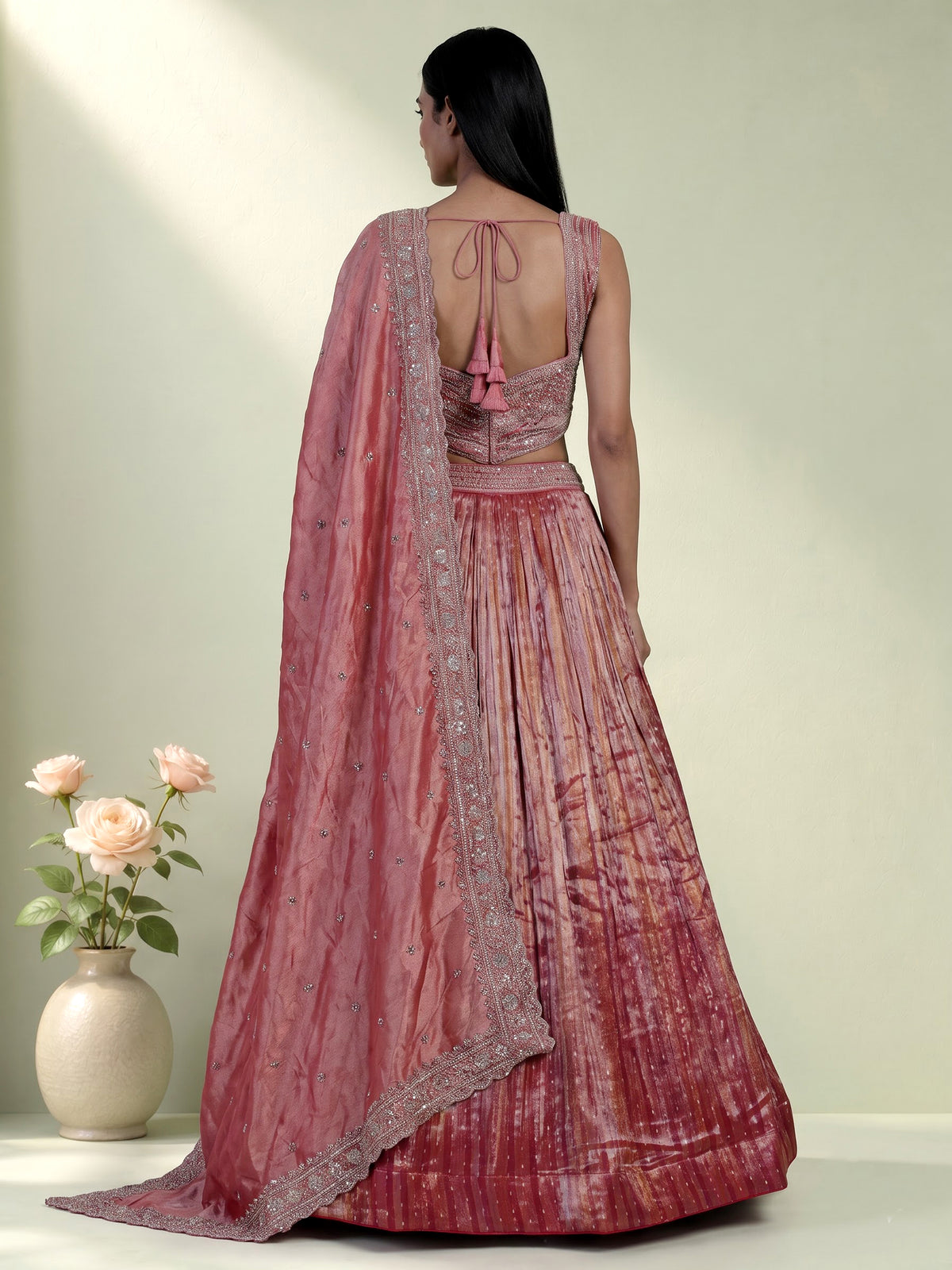Pastel pink tissue silk lehenga choli with embellished dupatta