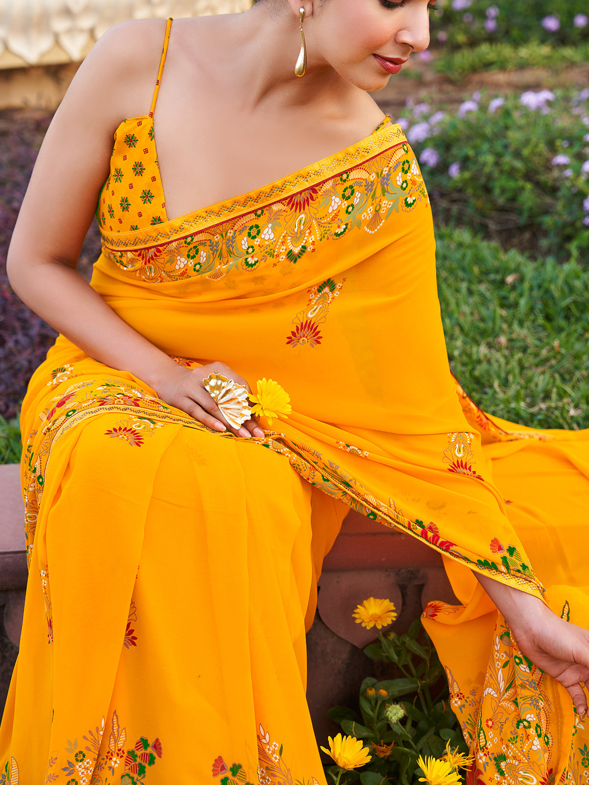 Yellow georgette saree with printed stone detailing