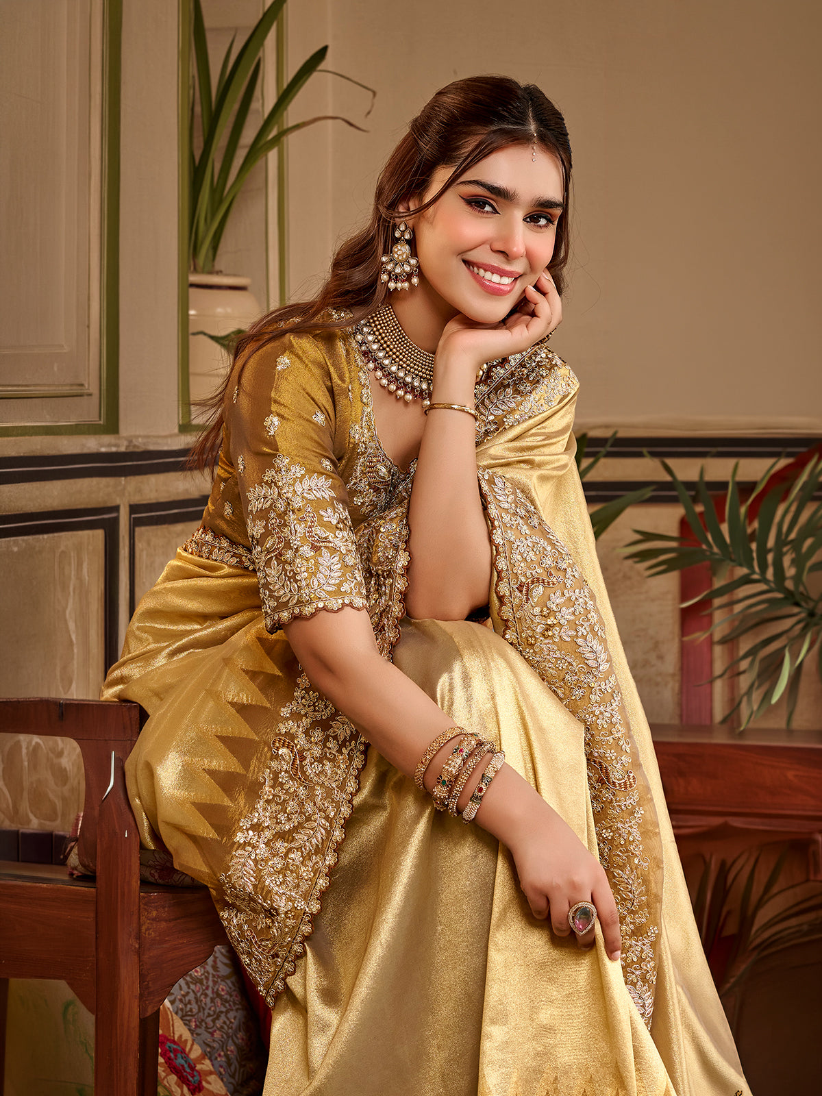 Golden yellow tissue silk women saree with rich detailing